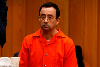Former Michigan State University and USA Gymnastics doctor Larry Nassar listens during the sentencing phase in Eaton, County Circuit Court on January 31, 2018 in Charlotte, Michigan. Last week Nassar was sentenced in Ingham County to 40 years to 175 years