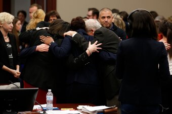 The prosecution and law enforcement team hug after former Michigan State University and USA Gymnastics doctor Larry Nassar was sentenced in Ingham County Circuit Court on January 24, 2018 in Lansing, Michigan.
Disgraced former USA Gymnastics doctor Larry 