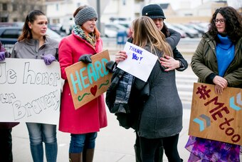 Women from the Michigan based victim advocacy groups End Violent Encounters and Firecracker Foundation cheer for women as they leave the courthouse after the sentencing of disgraced doctor Larry Nassar in Ingham County Circuit Court on January 24, 2018 in Lansing, Michigan. The former USA Gymnastics and Michigan State University doctor was sentenced to up to 175 years in prison for sexual assault after more than 150 women and girls confronted him in court and spoke of their abuse.
