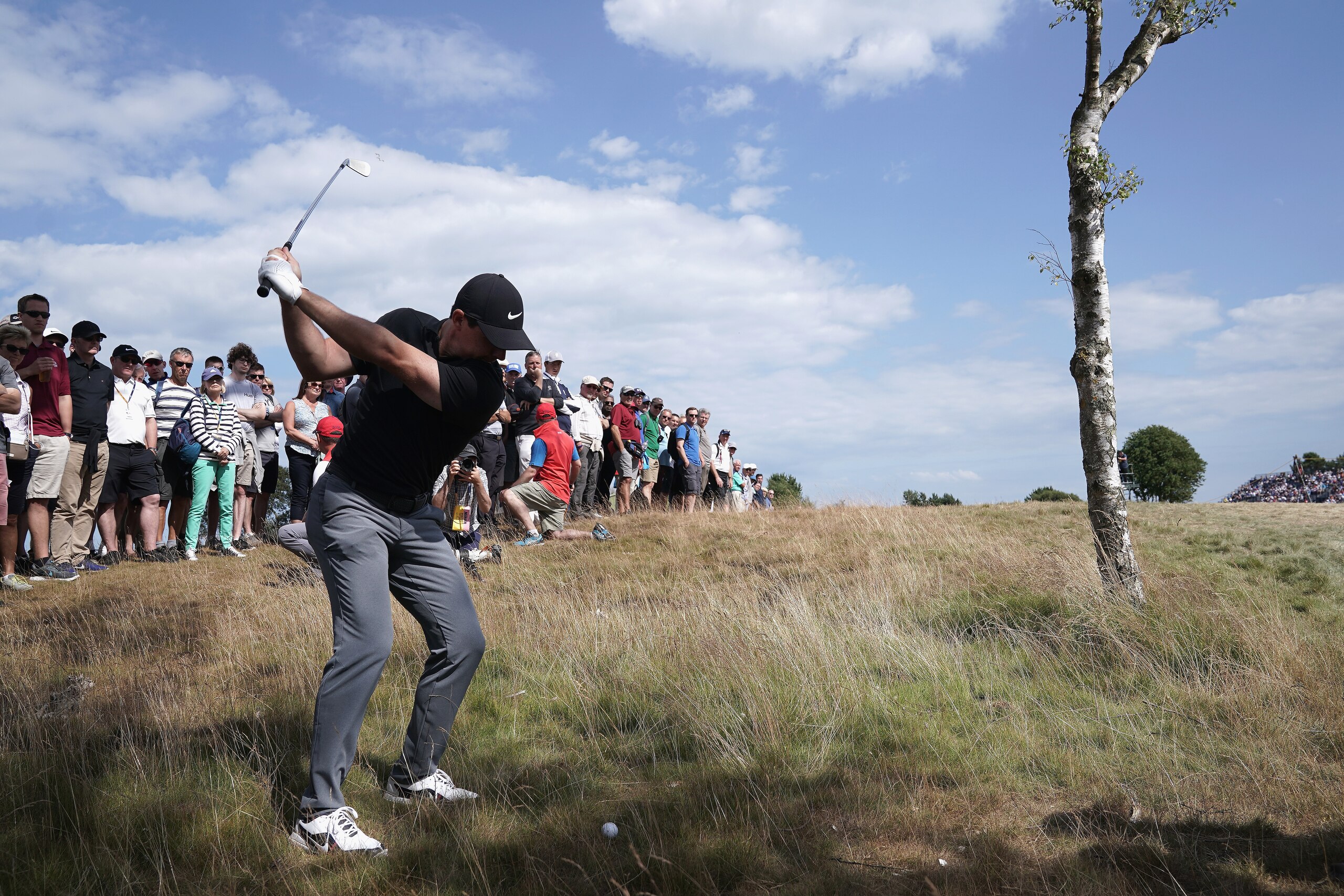 CARNOUSTIE, SCOTLAND - JULY 19:  Rory McIlroy of Ireland hits a shot from the rough during the first round of the 147th Open Championship at Carnoustie Golf Club on July 19, 2018 in Carnoustie, Scotland.  (Photo by Stuart Franklin/Getty Images)