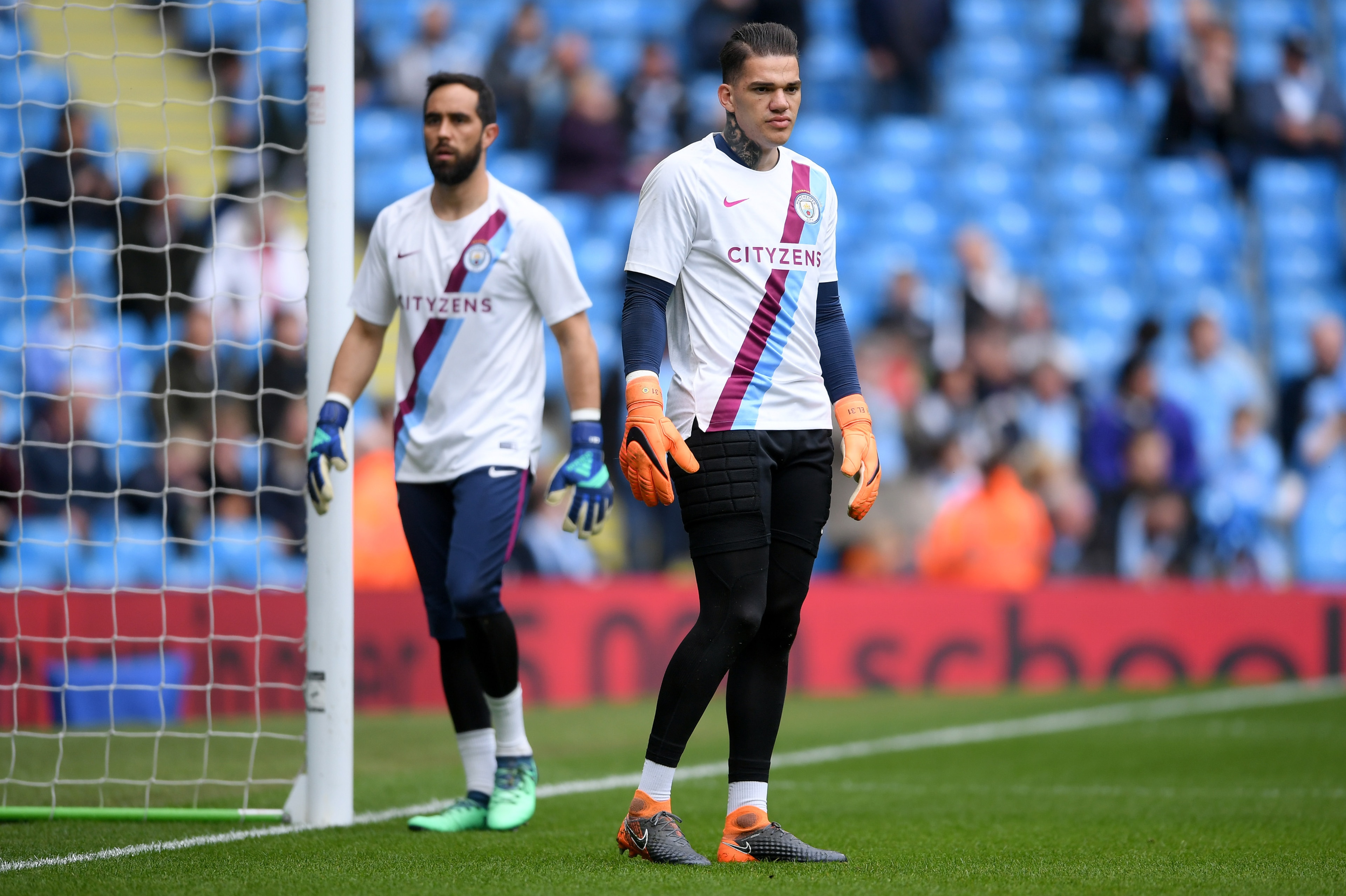 MANCHESTER, ENGLAND - APRIL 22: Claudio Bravo and Ederson of Manchester City warm up ahead of the Premier League match between Manchester City and Swansea City at Etihad Stadium on April 22, 2018 in Manchester, England.  (Photo by Laurence Griffiths/Getty
