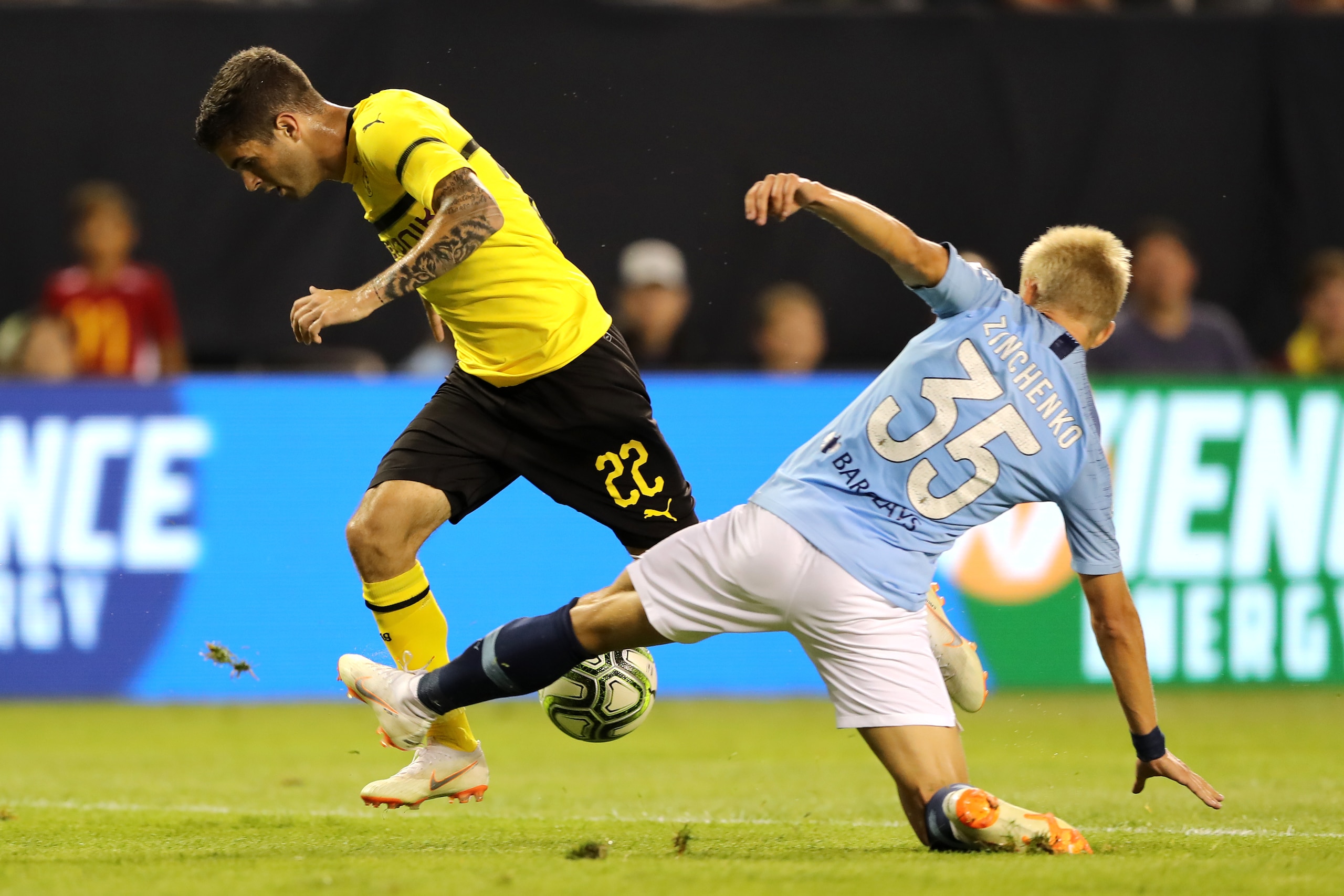 CHICAGO, IL - JULY 20:  Christian Pulisic #22 of Borussia Dortmund and Oleksandr Zinchenko #35 of Manchester City battle for the ball during an International Champions Cup match at Soldier Field on July 20, 2018 in Chicago, Illinois.  (Photo by Elsa/Getty