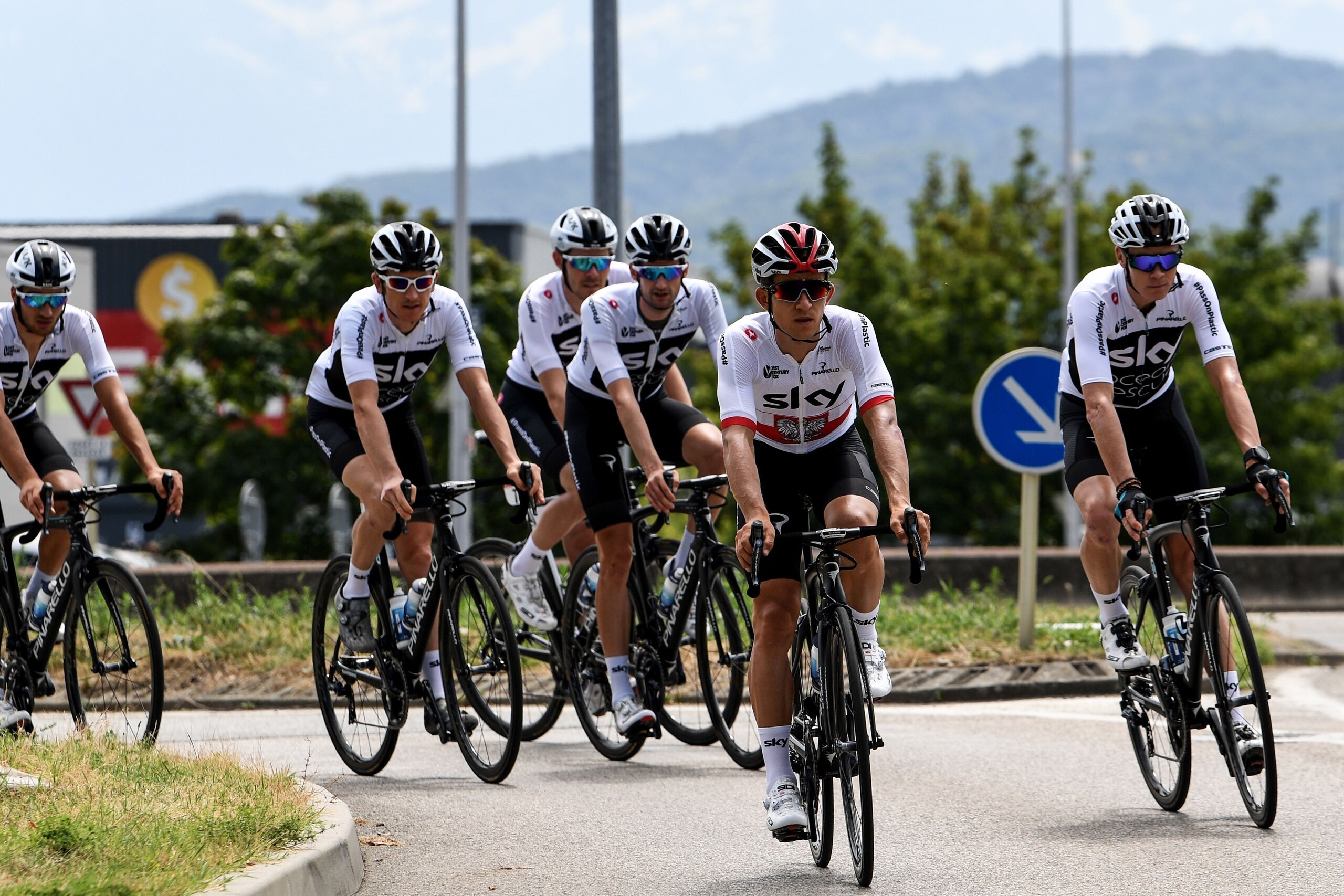 (From R) Great Britain's Team Sky cycling team teammates, Great Britain's Christopher Froome, Poland's Michal Kwiatkowski, Netherlands' Wout Poels, Great Britain's Luke Rowe, Great Britain's Geraint Thomas and Italy's Gianni Moscon ride back to their hote