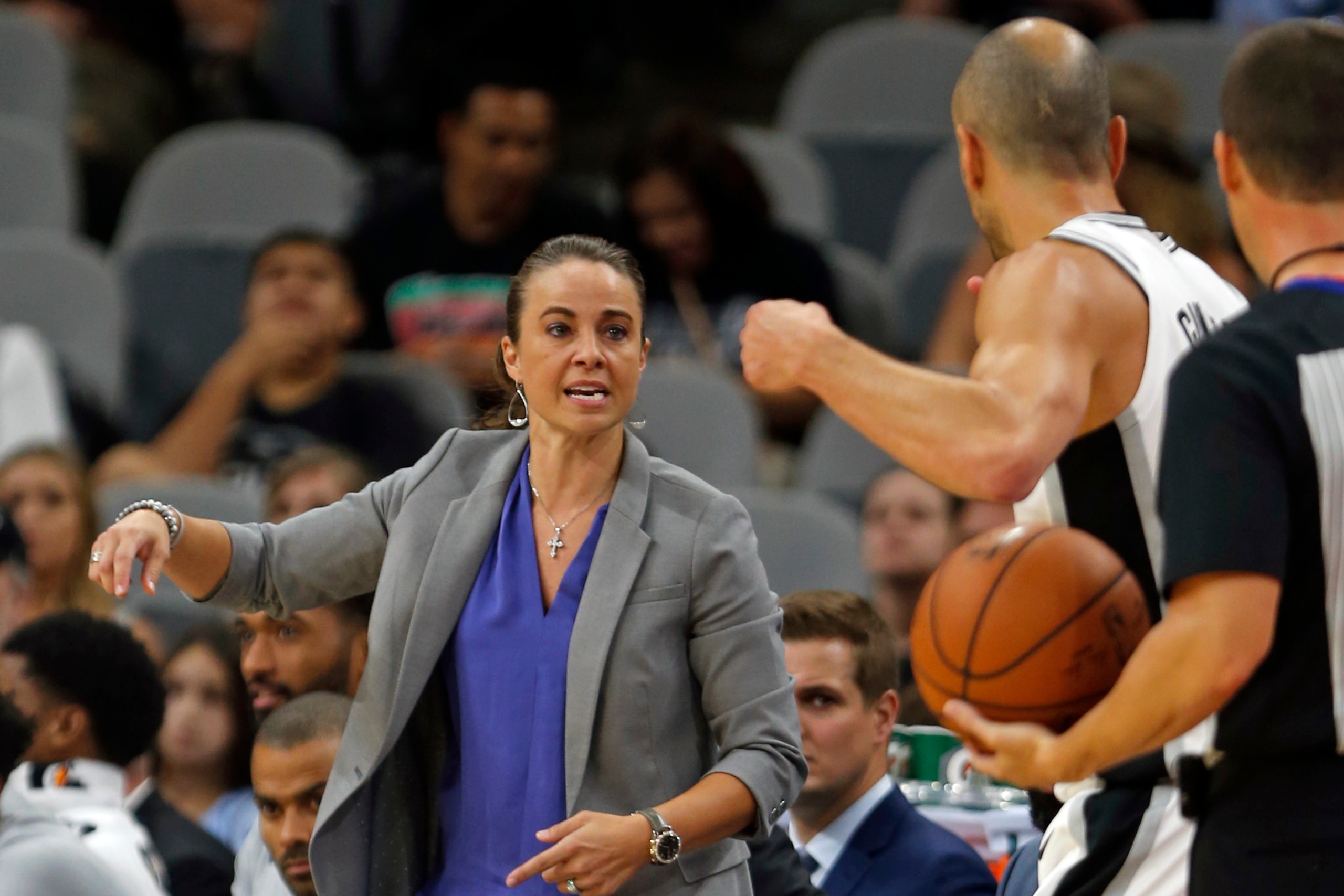 SAN ANTONIO,TX - OCTOBER 8: Filling in for head coach Gregg Popovich, Becky Hammon talks to Manu Ginobili #20 of the San Antonio Spurs during game against the Denver Nuggets at AT&T Center on October 8, 2017 in San Antonio, Texas. NOTE TO USER: User expre