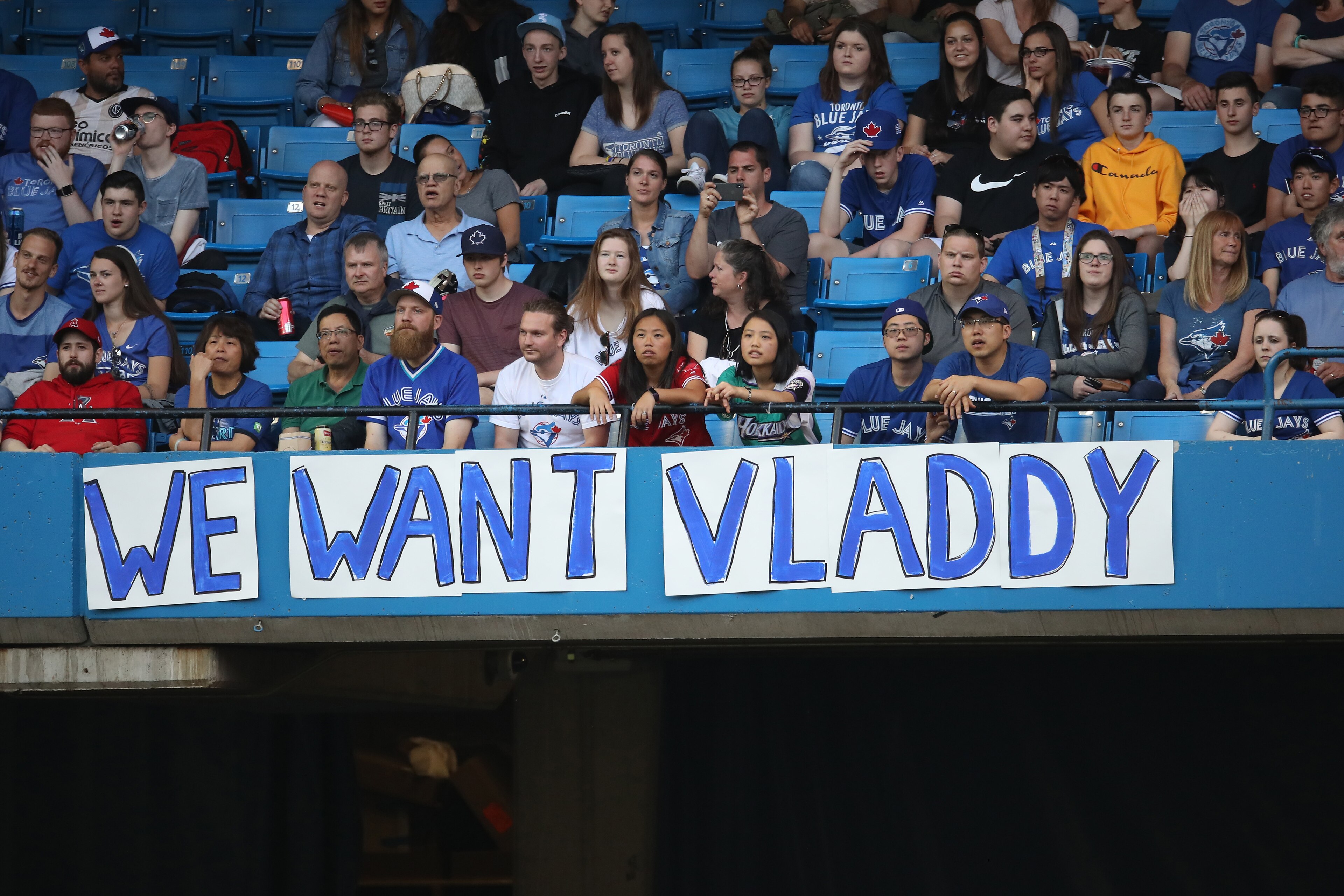 TORONTO, ON - MAY 23: Toronto Blue Jays fans hang a sign calling for Vladimir Guerrero Jr. to be brought up to the big league club during MLB game action against the Los Angeles Angels of Anaheim at Rogers Centre on May 23, 2018 in Toronto, Canada. (Phot TORONTO, ON - MAY 23: Toronto Blue Jays fans hang a sign calling for Vladimir Guerrero Jr. to be brought up to the big league club during MLB game action against the Los Angeles Angels of Anaheim at Rogers Centre on May 23, 2018 in Toronto, Canada. (Phot