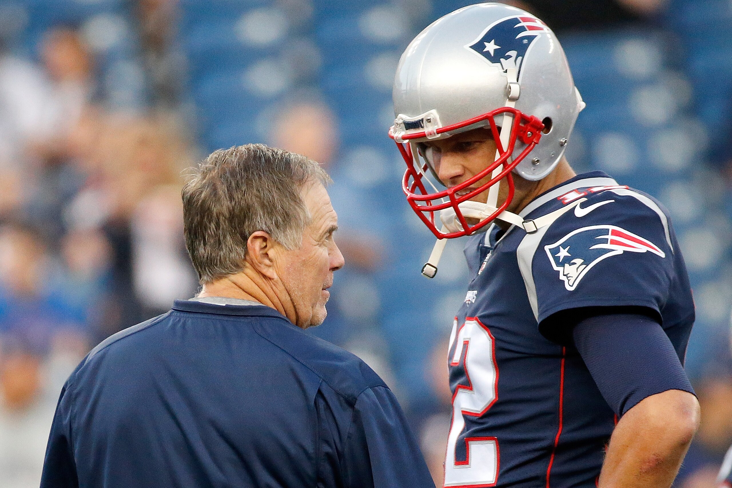 FOXBORO, MA - AUGUST 31: Bill Belichick of the New England Patriots and Tom Brady #12 chat before a preseason game with the New York Giants at Gillette Stadium on August 31, 2017 in Foxboro, Massachusetts. (Photo by Jim Rogash/Getty Images)
