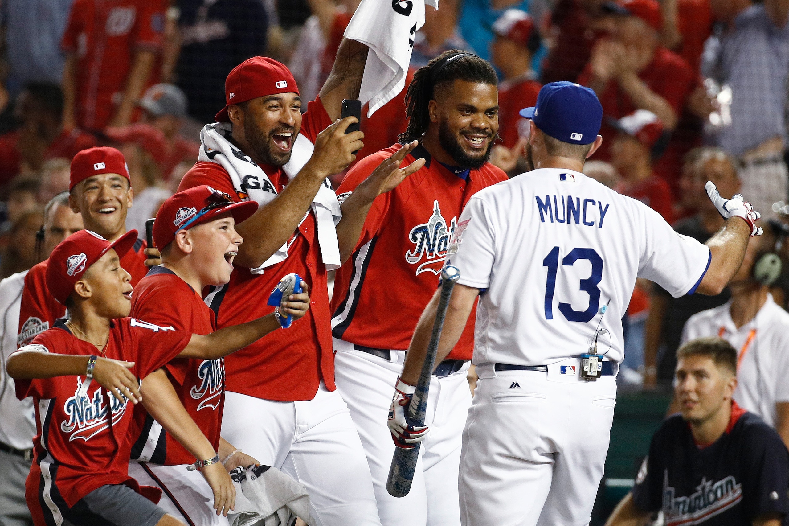 Max Muncy accepts congratulations after his first-round victory in the Home Run Derby.