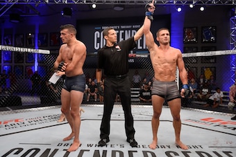 LAS VEGAS, NV - JULY 24:  Alex Munoz celebrates after his decision victory over Nick Newell in their lightweight fight during Dana White's Tuesday Night Contender Series at the TUF Gym on July 24, 2018 in Las Vegas, Nevada. (Photo by Chris Unger/DWTNCS LL