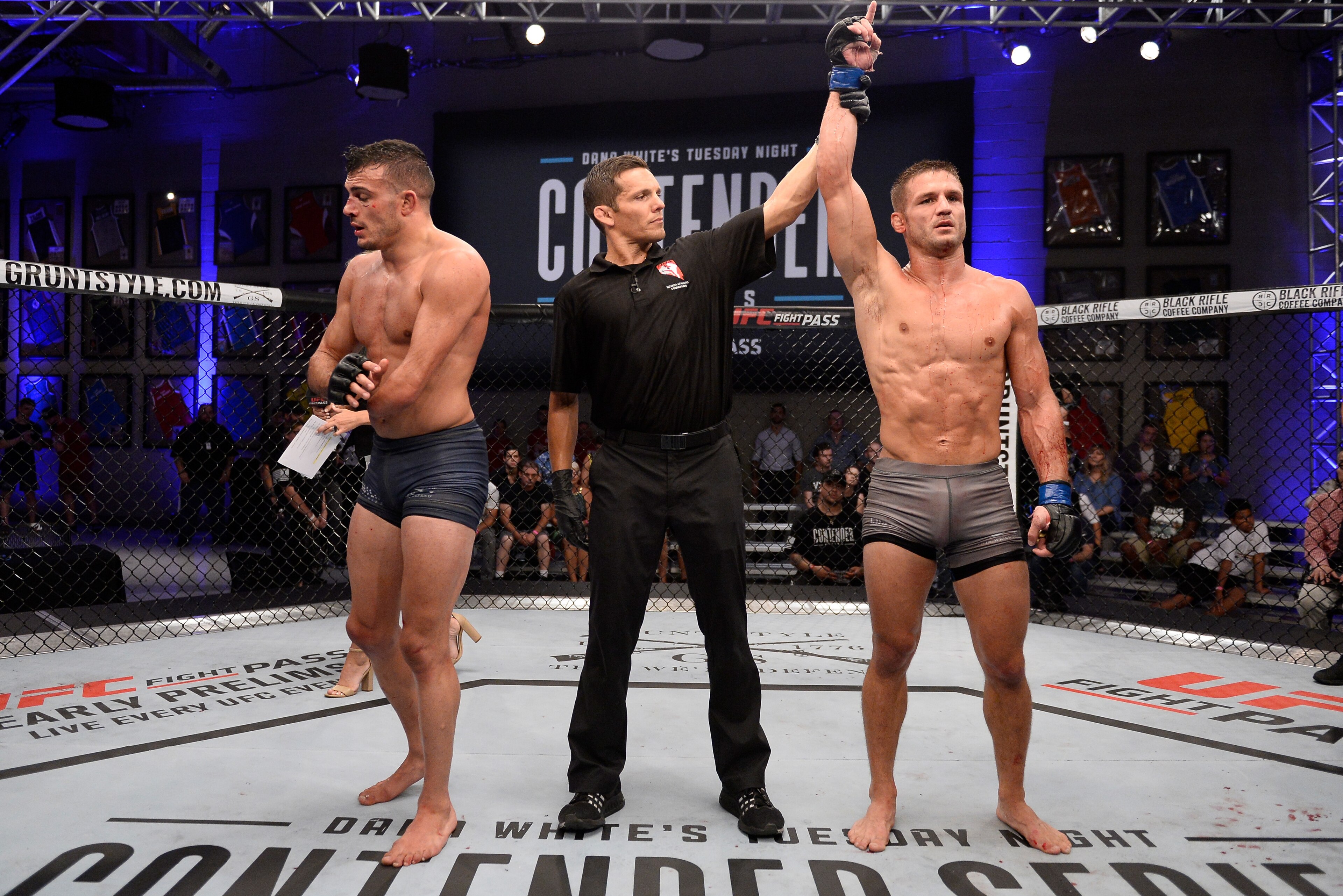 LAS VEGAS, NV - JULY 24:  Alex Munoz celebrates after his decision victory over Nick Newell in their lightweight fight during Dana White's Tuesday Night Contender Series at the TUF Gym on July 24, 2018 in Las Vegas, Nevada. (Photo by Chris Unger/DWTNCS LL