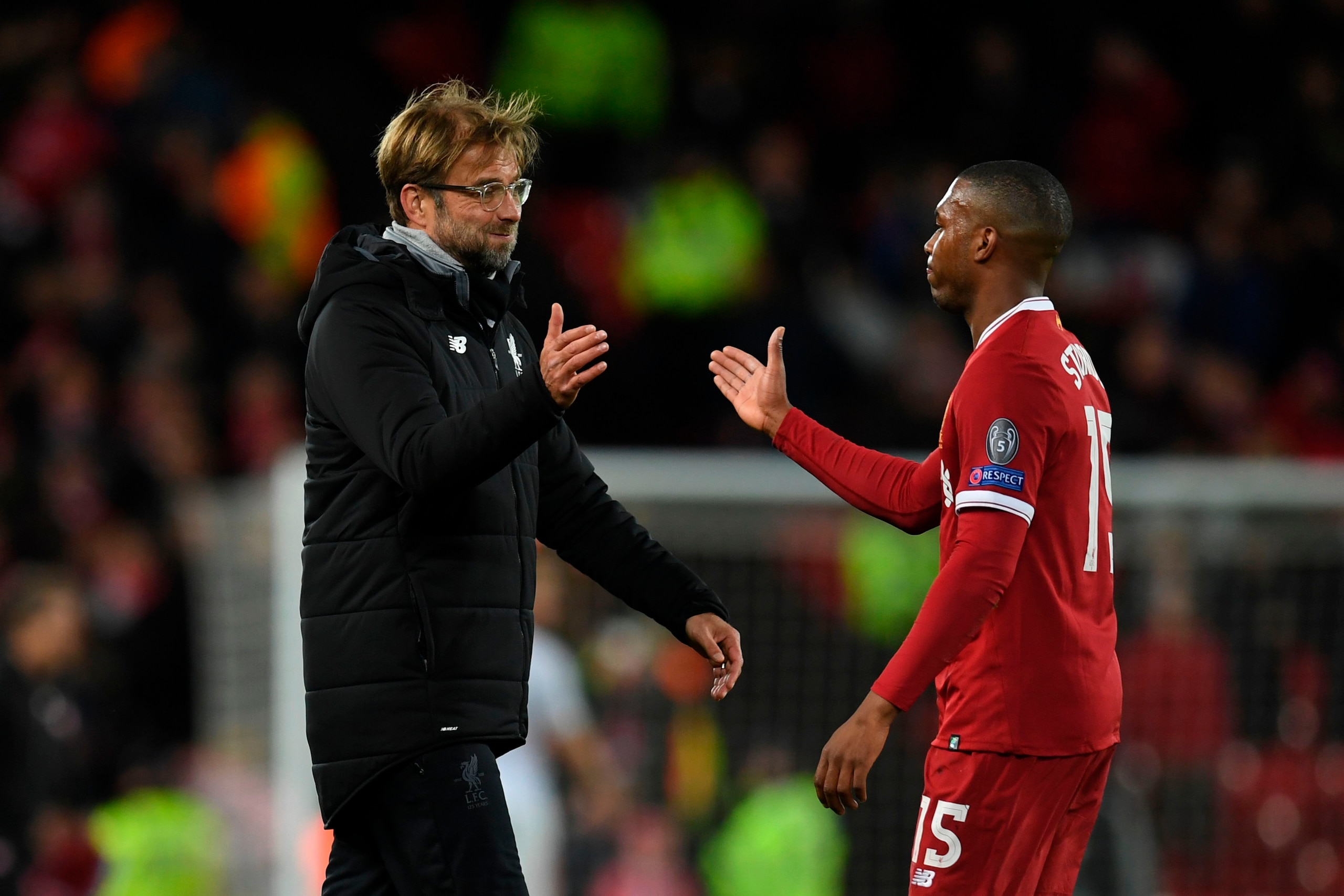 Liverpool's German manager Jurgen Klopp (L) shakes hands with Liverpool's English striker Daniel Sturridge (R) at the end of the UEFA Champions League Group E football match between Liverpool and Spartak Moscow at Anfield in Liverpool, north-west England 