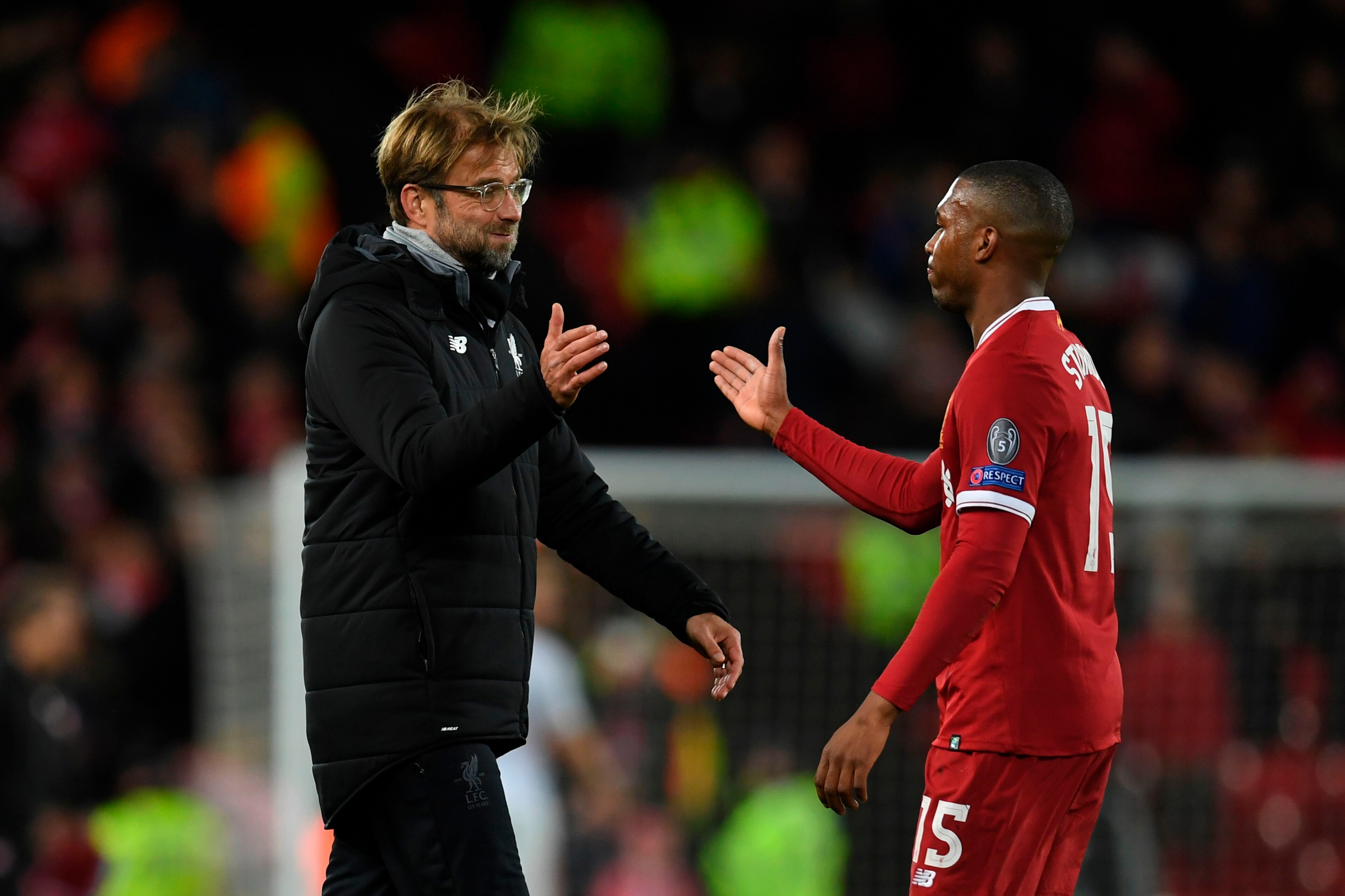 Liverpool's German manager Jurgen Klopp (L) shakes hands with Liverpool's English striker Daniel Sturridge (R) at the end of the UEFA Champions League Group E football match between Liverpool and Spartak Moscow at Anfield in Liverpool, north-west England 