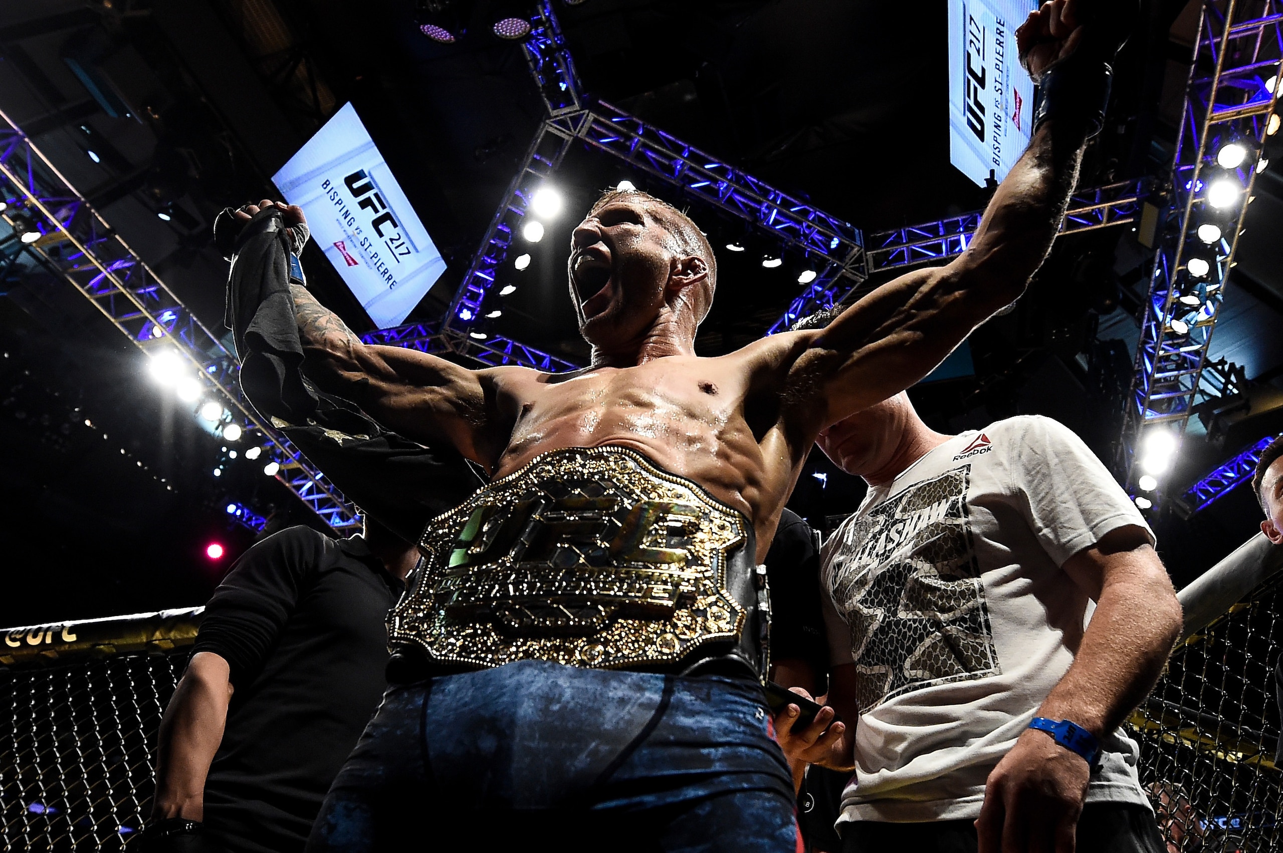 NEW YORK, NY - NOVEMBER 04:  TJ Dillashaw celebrates his knockout victory over Cody Garbrandt in their UFC bantamweight championship bout during the UFC 217 event inside Madison Square Garden on November 4, 2017 in New York City. (Photo by Brandon Magnus/