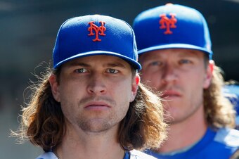 NEW YORK, NY - SEPTEMBER 04:  Jacob deGrom #48 (L) and Noah Syndergaard #34 of the New York Mets look on against the Philadelphia Phillies at Citi Field on September 4, 2017 in the Flushing neighborhood of the Queens borough of New York City. The Mets def