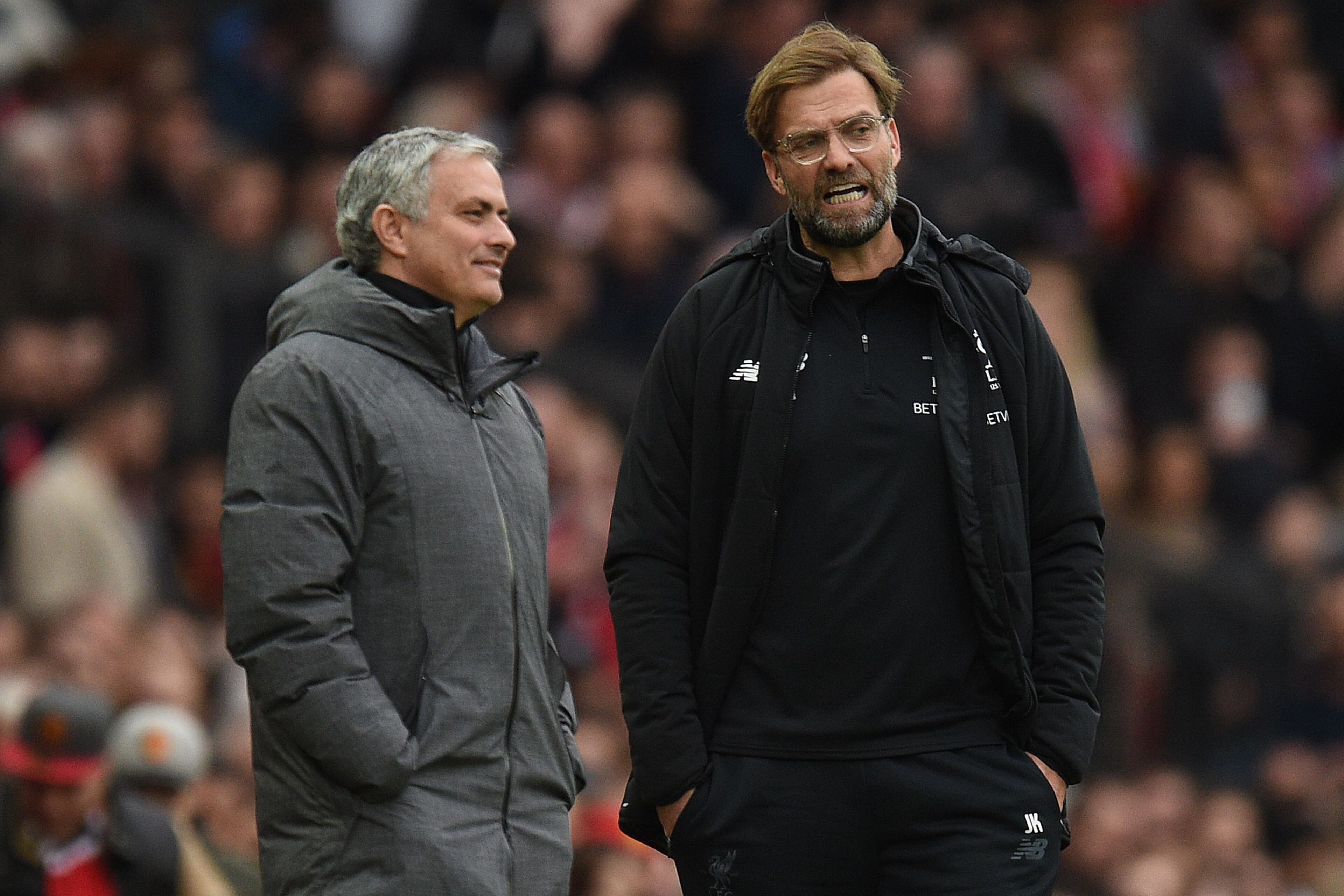 Manchester United's Portuguese manager Jose Mourinho (L) talks with Liverpool's German manager Jurgen Klopp (R) during the English Premier League football match between Manchester United and Liverpool at Old Trafford in Manchester, north west England, on Manchester United's Portuguese manager Jose Mourinho (L) talks with Liverpool's German manager Jurgen Klopp (R) during the English Premier League football match between Manchester United and Liverpool at Old Trafford in Manchester, north west England, on