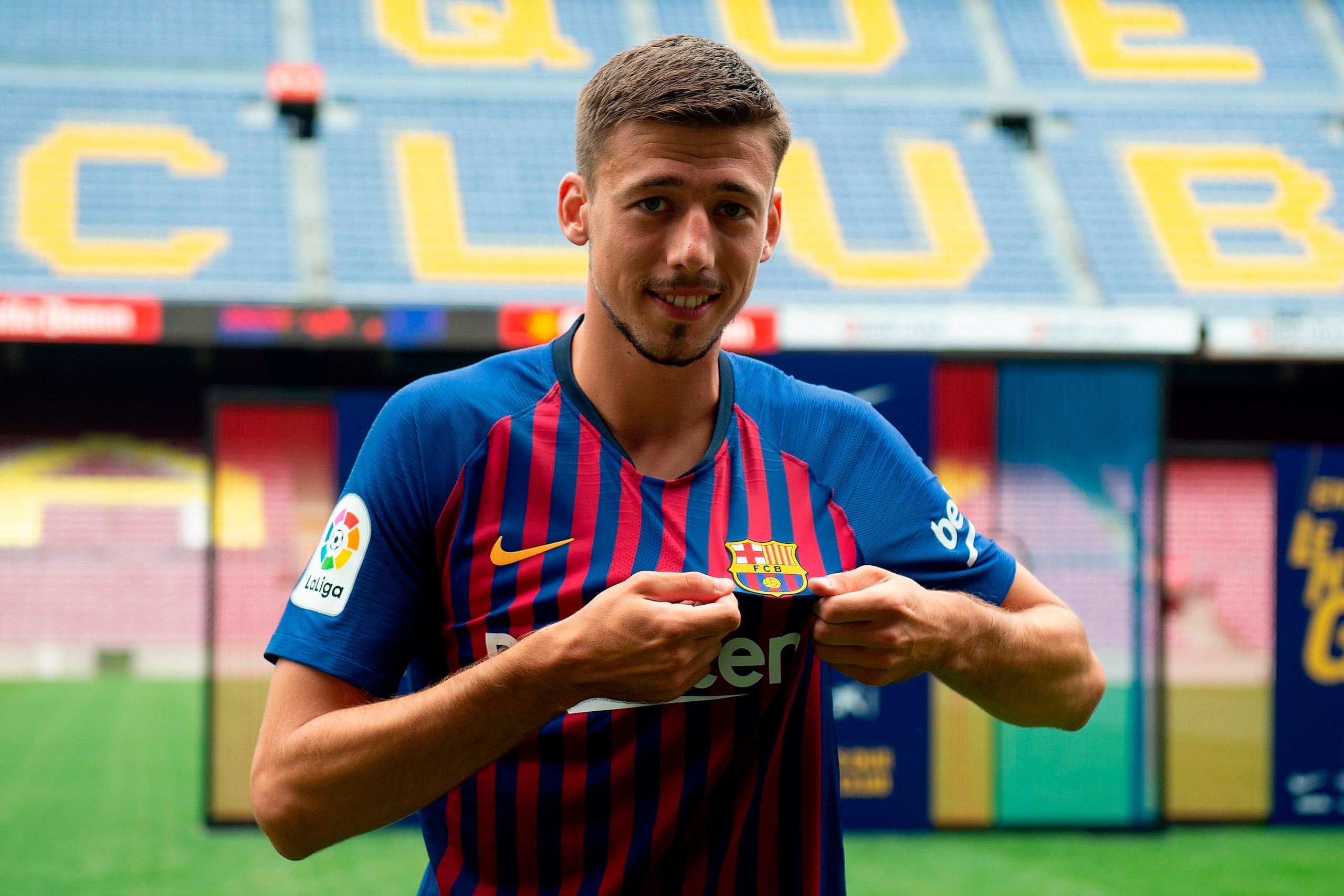 Barcelona«'s new player French defender Clement Lenglet poses with his new jersey during his official presentation at the Camp Nou stadium in Barcelona on July 13, 2018. - Clement Lenglet will join up with compatriots Samuel Umtiti and Ousmane Dembele at Barcelona«'s new player French defender Clement Lenglet poses with his new jersey during his official presentation at the Camp Nou stadium in Barcelona on July 13, 2018. - Clement Lenglet will join up with compatriots Samuel Umtiti and Ousmane Dembele at