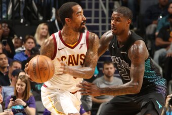 CHARLOTTE, NC - MARCH 28:  JR Smith #5 of the Cleveland Cavaliers handles the ball against Marvin Williams #2 of the Charlotte Hornets on March 28, 2018 at Spectrum Center in Charlotte, North Carolina. NOTE TO USER: User expressly acknowledges and agrees 