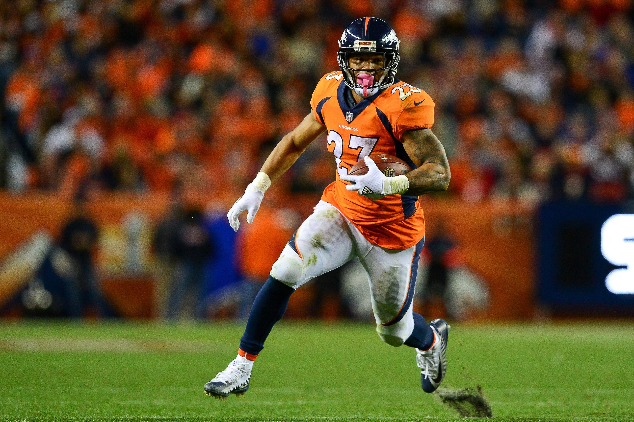 DENVER, CO - NOVEMBER 19:  Running back Devontae Booker #23 of the Denver Broncos rushes against the Cincinnati Bengals at Sports Authority Field at Mile High on November 19, 2017 in Denver, Colorado. (Photo by Dustin Bradford/Getty Images)