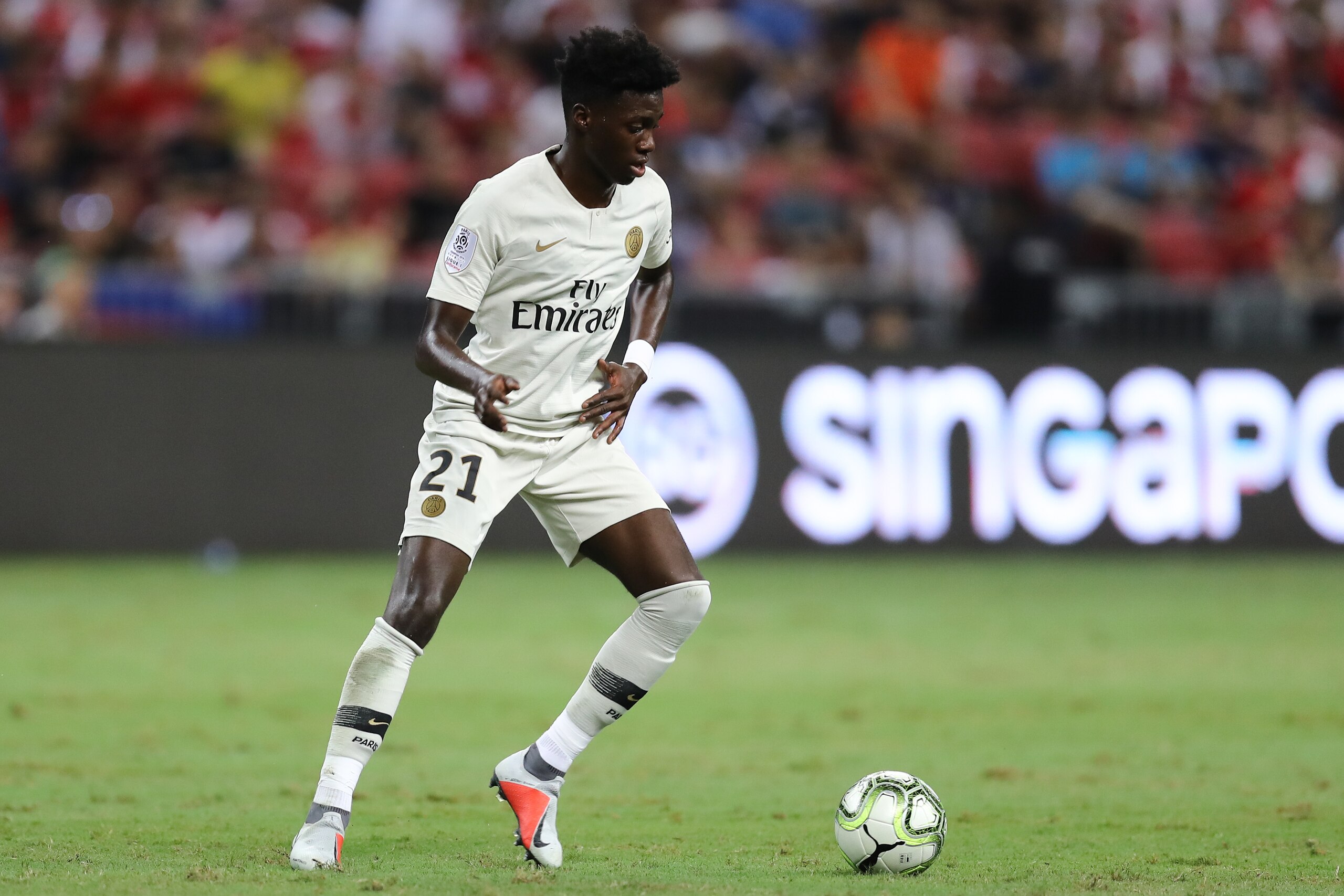 SINGAPORE, SINGAPORE - JULY 28: Timothy Weah #21 of Paris Saint Germain in action during the International Champions Cup match between Arsenal and Paris Saint Germain at the National Stadium on July 28, 2018 in Singapore. (Photo by Pakawich Damrongkiattis