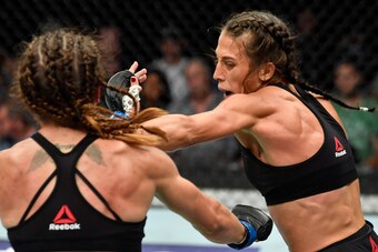 CALGARY, AB - JULY 28:  (R-L) Joanna Jedrzejczyk of Poland punches Tecia Torres in their women's strawweight bout during the UFC Fight Night event at Scotiabank Saddledome on July 28, 2018 in Calgary, Alberta, Canada. (Photo by Jeff Bottari/Zuffa LLC/Zuff