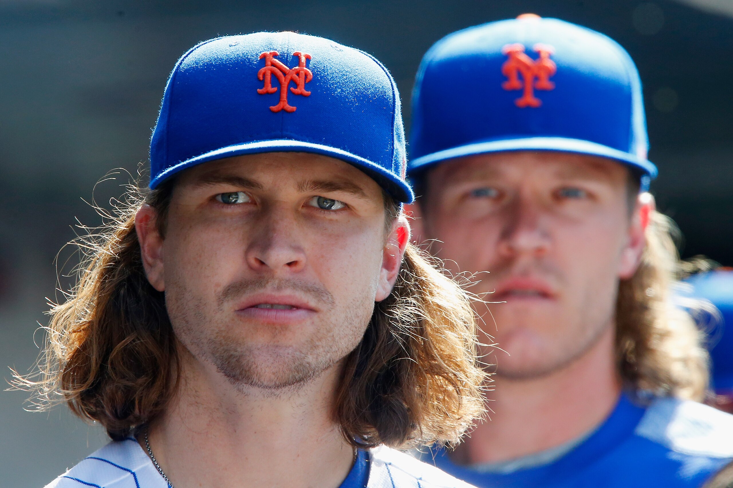 NEW YORK, NY - SEPTEMBER 04:  Jacob deGrom #48 (L) and Noah Syndergaard #34 of the New York Mets look on against the Philadelphia Phillies at Citi Field on September 4, 2017 in the Flushing neighborhood of the Queens borough of New York City. The Mets def