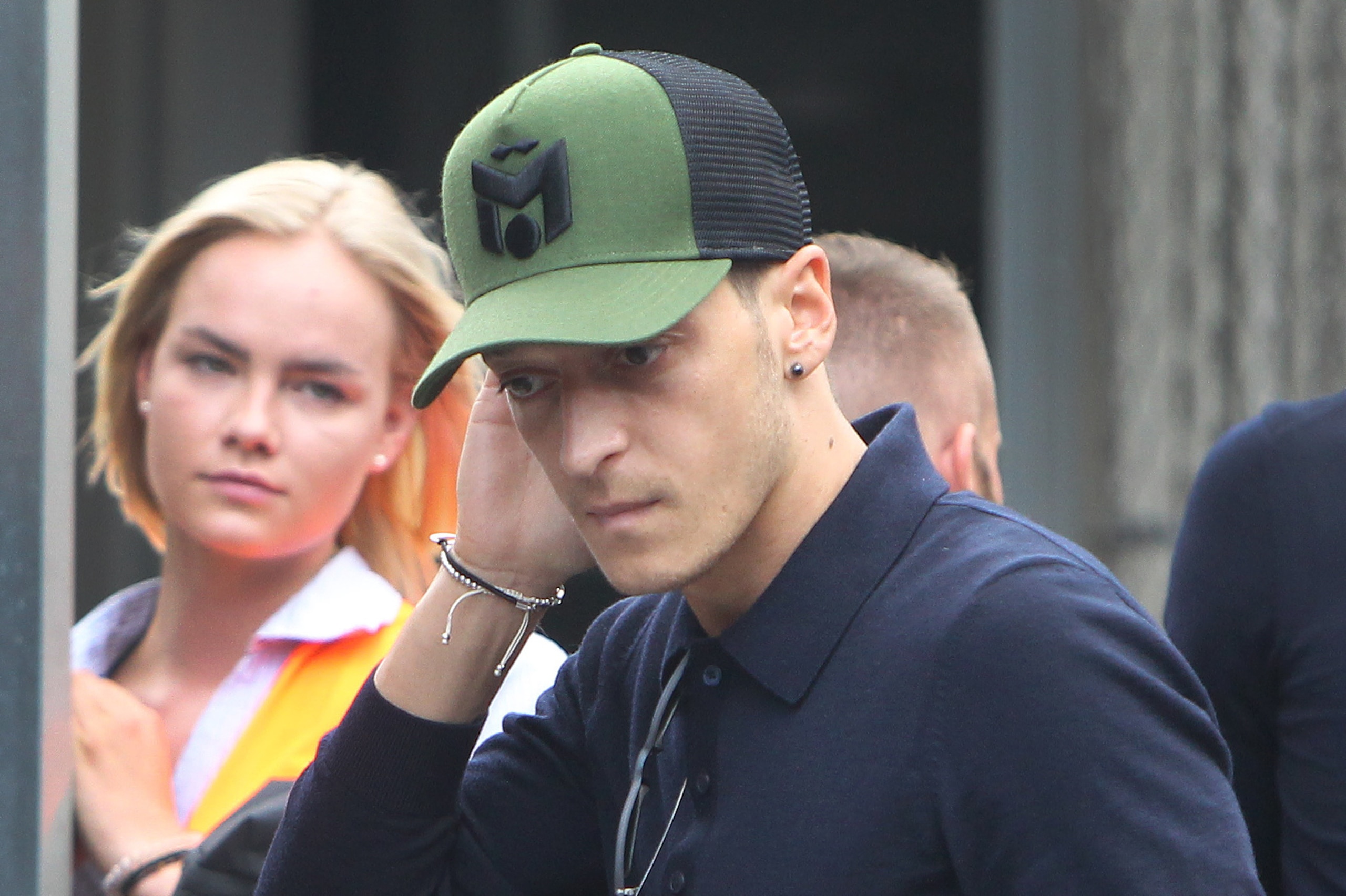 Germany's midfielder Mesut Ozil arrives at Frankfurt international airport on June 28, 2018, after flying back from Moscow following the German national football team's defeat in the Russia 2018 football World Cup. - Germany's embattled national team brac