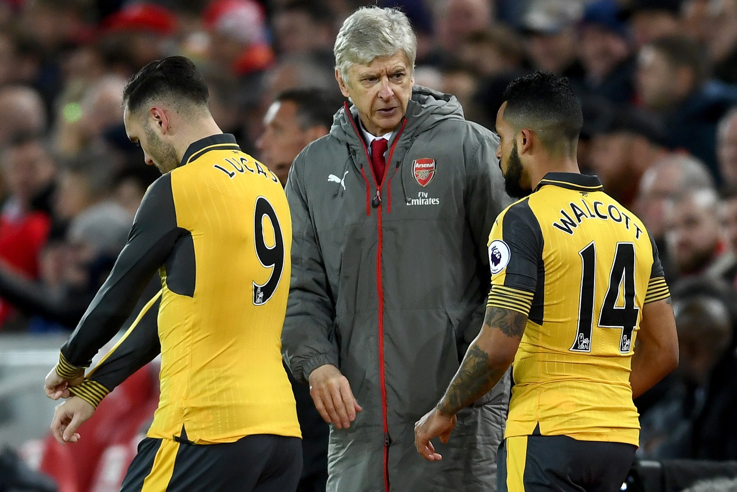 LIVERPOOL, ENGLAND - MARCH 04: Arsene Wenger, Manager of Arsenal (C) speaks to Lucas Perez of Arsenal (L) and Theo Walcott of Arsenal (R) before they come on during the Premier League match between Liverpool and Arsenal at Anfield on March 4, 2017 in Live LIVERPOOL, ENGLAND - MARCH 04: Arsene Wenger, Manager of Arsenal (C) speaks to Lucas Perez of Arsenal (L) and Theo Walcott of Arsenal (R) before they come on during the Premier League match between Liverpool and Arsenal at Anfield on March 4, 2017 in Live