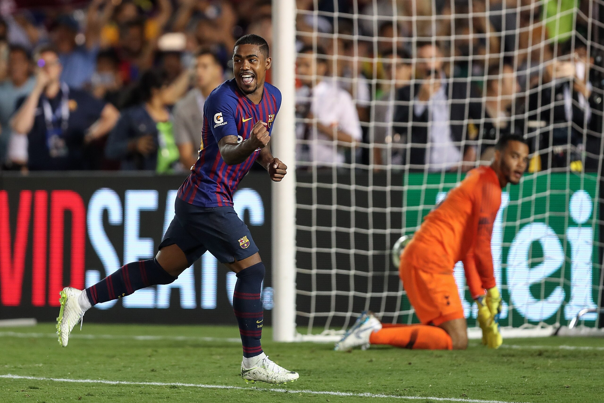 PASADENA, CA - JULY 28:  Malcom #26 of FC Barcelona celebrates after scoring the match winning penalty over Tottenham Hotspur during an International Champions Cup match at Rose Bowl on July 28, 2018 in Pasadena, California.  (Photo by Joe Scarnici/Intern