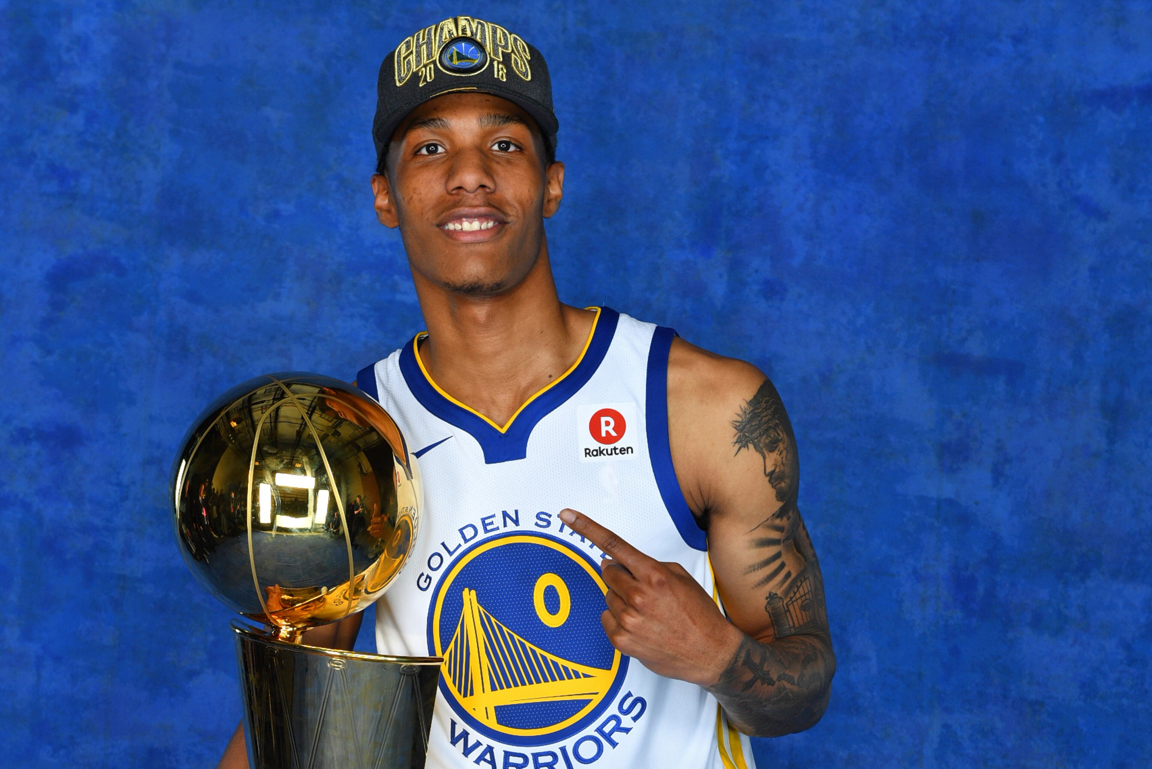 CLEVELAND, OH - JUNE 8:  Patrick McCaw #0 of the Golden State Warriors poses for a portrait with the Larry O'Brien Trophy after winning Game Four of the 2018 NBA Finals against the Cleveland Cavaliers on June 8, 2018 at Quicken Loans Arena in Cleveland, O