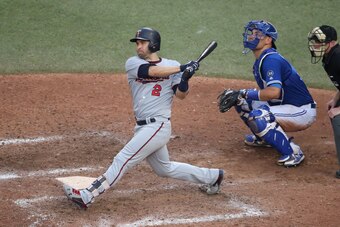 TORONTO, ON - JULY 25: Brian Dozier #2 of the Minnesota Twins hits a double in the eleventh inning during MLB game action against the Toronto Blue Jays at Rogers Centre on July 25, 2018 in Toronto, Canada. (Photo by Tom Szczerbowski/Getty Images)