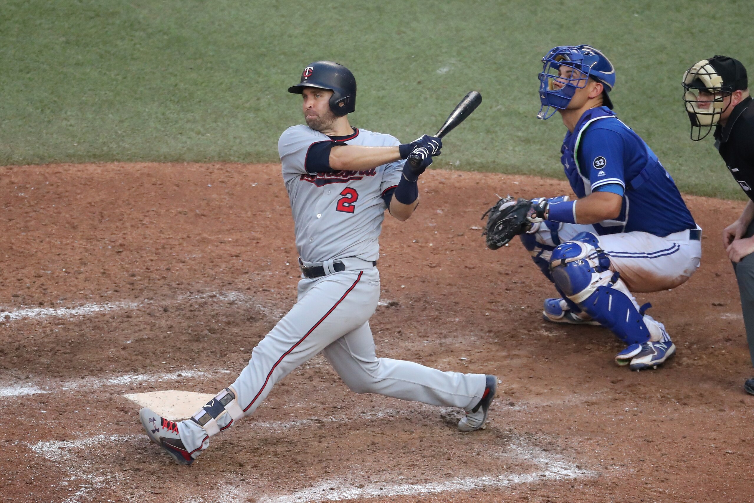 TORONTO, ON - JULY 25: Brian Dozier #2 of the Minnesota Twins hits a double in the eleventh inning during MLB game action against the Toronto Blue Jays at Rogers Centre on July 25, 2018 in Toronto, Canada. (Photo by Tom Szczerbowski/Getty Images) TORONTO, ON - JULY 25: Brian Dozier #2 of the Minnesota Twins hits a double in the eleventh inning during MLB game action against the Toronto Blue Jays at Rogers Centre on July 25, 2018 in Toronto, Canada. (Photo by Tom Szczerbowski/Getty Images)