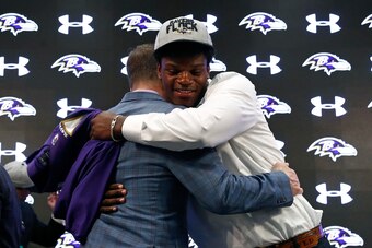 Ravens coach John Harbaugh and Lamar Jackson embrace on draft day.