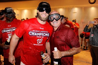 WASHINGTON, DC - SEPTEMBER 10:  Bryce Harper #34 of the Washington Nationals celebrates with General Manager Mike Rizzo after clinching the National League East after the game against the Philadelphia Phillies at Nationals Park on September 10, 2017 in Wa