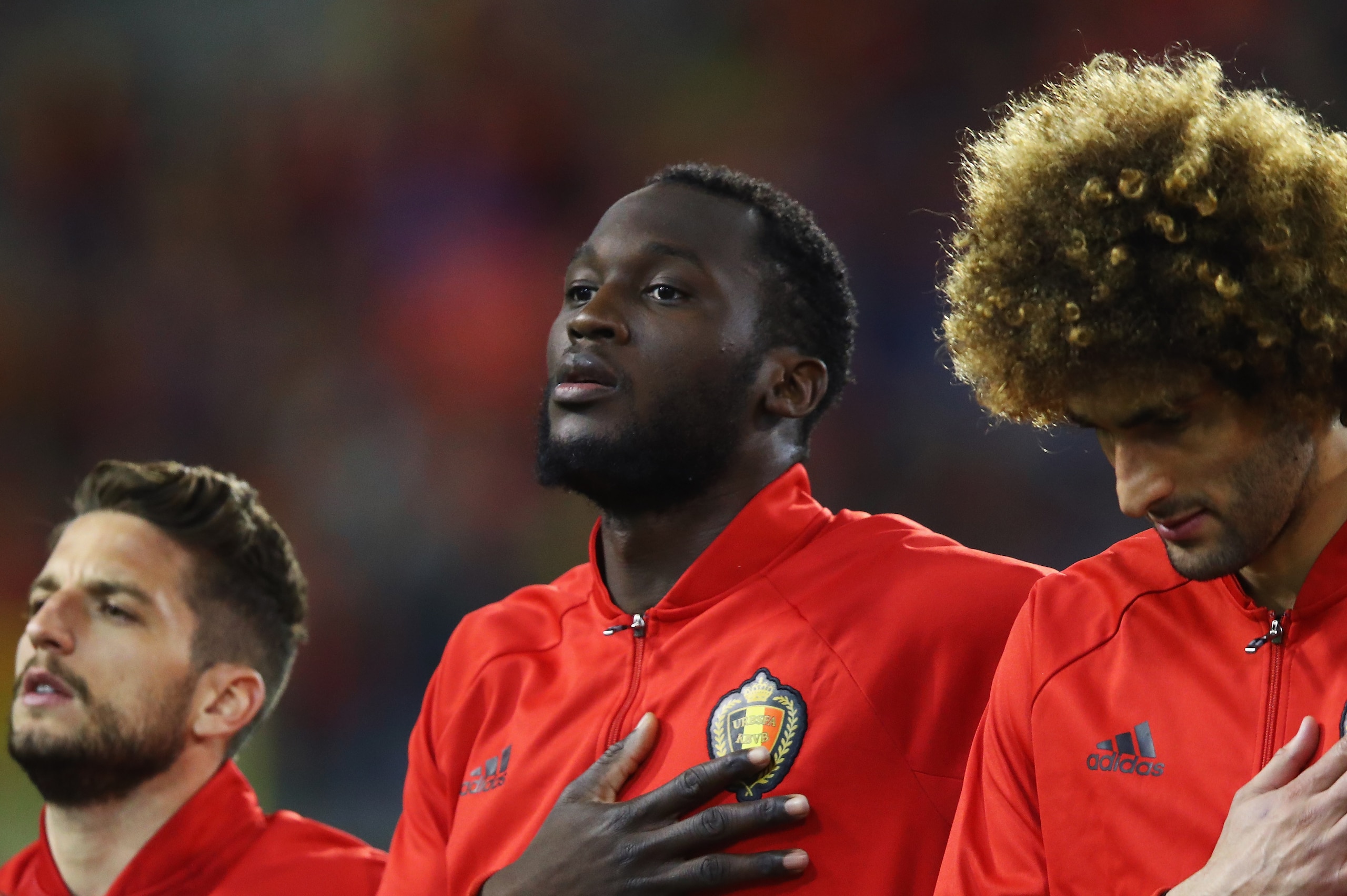 BRUSSELS, BELGIUM - MARCH 25:  (L-R)  Dries Mertens, Romelu Lukaku and Marouane Fellaini of Belgium stand for the national anthem prior to the FIFA 2018 World Cup Group H  Qualifier match between Belgium and Greece at Stade Roi Baudouis on March 25, 2017 