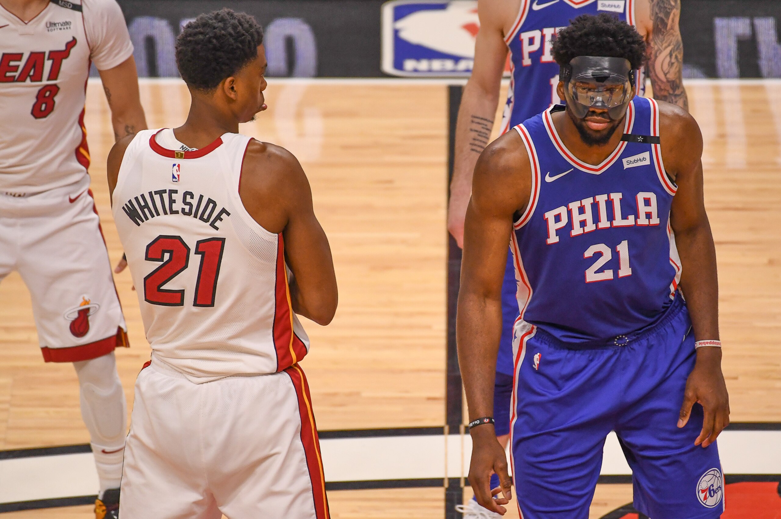 MIAMI, FL - APRIL 21: Hassan Whiteside #21 of the Miami Heat gets ready to tip off against Joel Embiid #21 of the Philadelphia 76ers in the first quarter during Game Four of Round One of the 2018 NBA Playoffs at American Airlines Arena on April 21, 2018 MIAMI, FL - APRIL 21: Hassan Whiteside #21 of the Miami Heat gets ready to tip off against Joel Embiid #21 of the Philadelphia 76ers in the first quarter during Game Four of Round One of the 2018 NBA Playoffs at American Airlines Arena on April 21, 2018