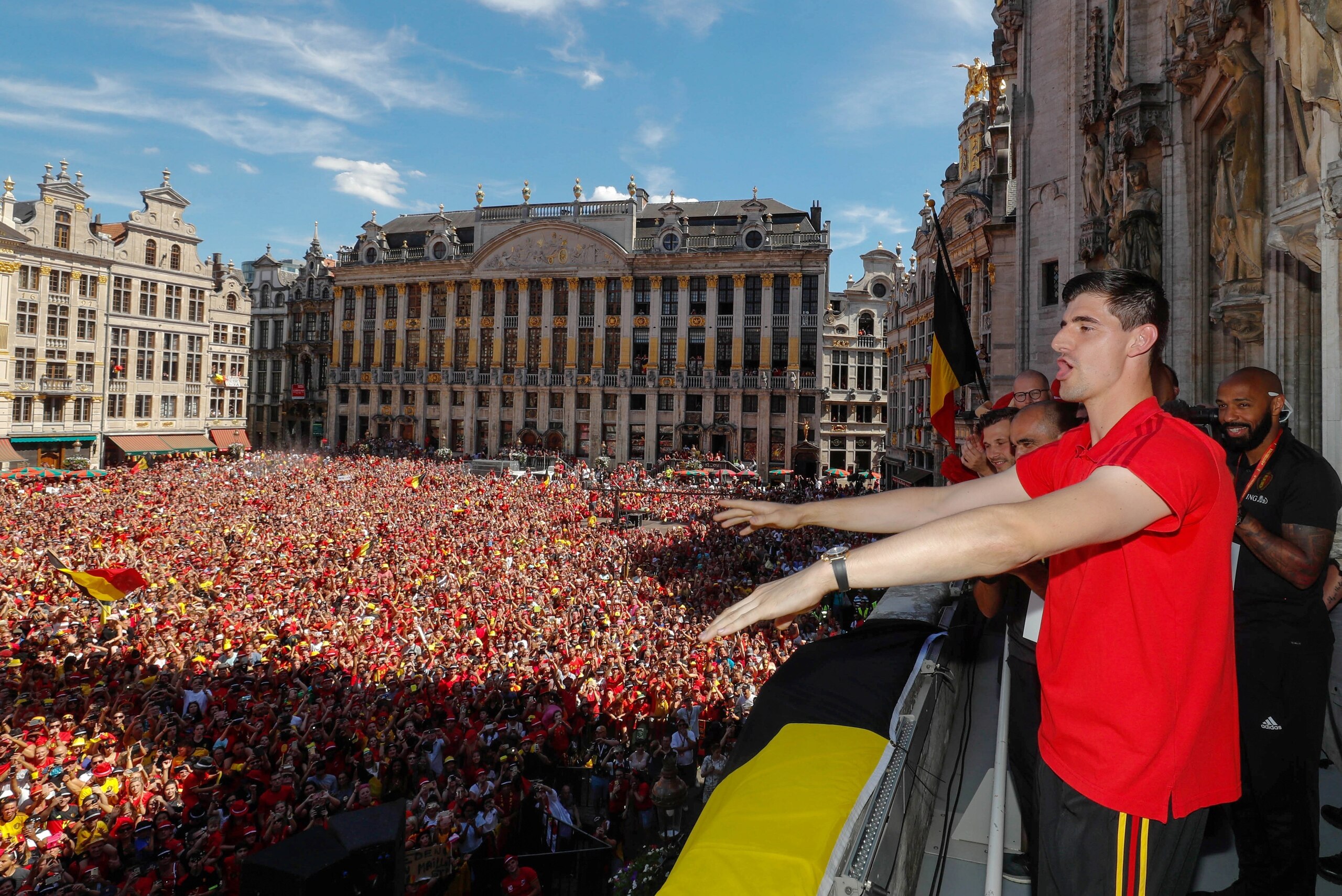 Belgium's goalkeeper Thibaut Courtois celebrates on the balcony in front of more than 8000 supporters at the Grand Place/Grote Markt in Brussels city center, as Belgian national football team Red Devils arrive to celebrate with supporters at the balcony o Belgium's goalkeeper Thibaut Courtois celebrates on the balcony in front of more than 8000 supporters at the Grand Place/Grote Markt in Brussels city center, as Belgian national football team Red Devils arrive to celebrate with supporters at the balcony o