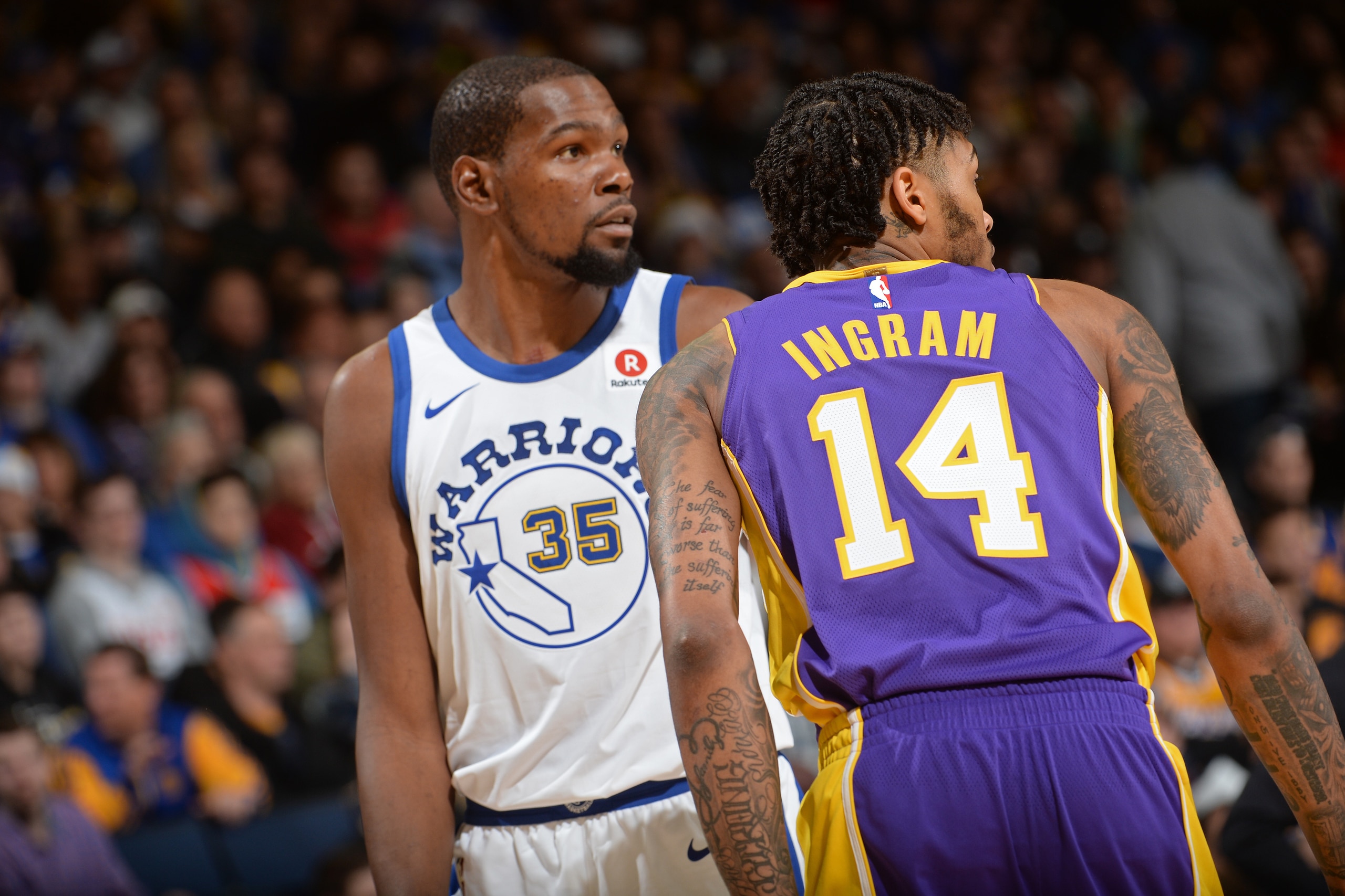 OAKLAND, CA - DECEMBER 22:  Kevin Durant #35 of the Golden State Warriors and Brandon Ingram #14 of the Los Angeles Lakers walk up the court during the game on December 22, 2017 at ORACLE Arena in Oakland, California. NOTE TO USER: User expressly acknowle