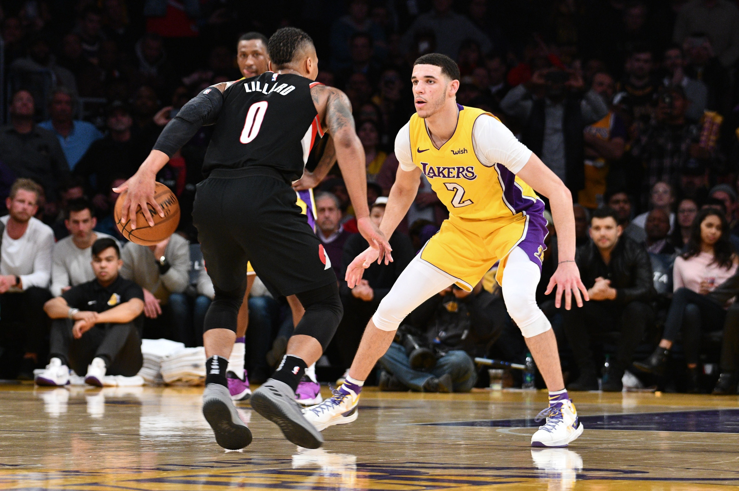 Lonzo Ball #2 of the Los Angeles Lakers defends against Damian Lillard #0 of the Portland Trail Blazers during the fourth quarter of a basketball game between the two teams at Staples Center on March 5, 2018 in Los Angeles, California. Lonzo Ball #2 of the Los Angeles Lakers defends against Damian Lillard #0 of the Portland Trail Blazers during the fourth quarter of a basketball game between the two teams at Staples Center on March 5, 2018 in Los Angeles, California.