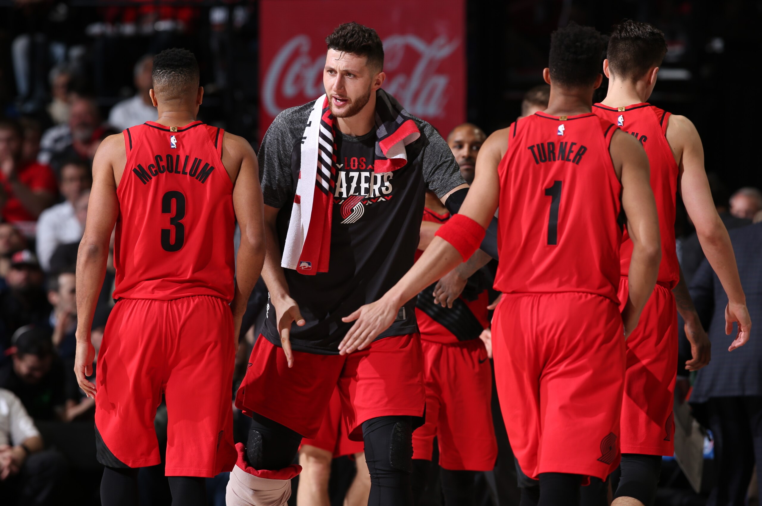 PORTLAND, OR - MARCH 1: Jusuf Nurkic #27 of the Portland Trail Blazers high fives teammates CJ McCollum #3 and Evan Turner #1 of the Portland Trail Blazers during the game against the Minnesota Timberwolves on March 1, 2018 at the Moda Center Arena in Por PORTLAND, OR - MARCH 1: Jusuf Nurkic #27 of the Portland Trail Blazers high fives teammates CJ McCollum #3 and Evan Turner #1 of the Portland Trail Blazers during the game against the Minnesota Timberwolves on March 1, 2018 at the Moda Center Arena in Por