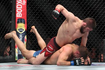 NEW YORK, NY - APRIL 07: Khabib Nurmagomedov (top) throws a punch at Al Iaquinta (bottom) during their UFC lightweight championship bout at UFC 223 at Barclays Center on April 7, 2018 in New York City. (Photo by Ed Mulholland/Getty Images)