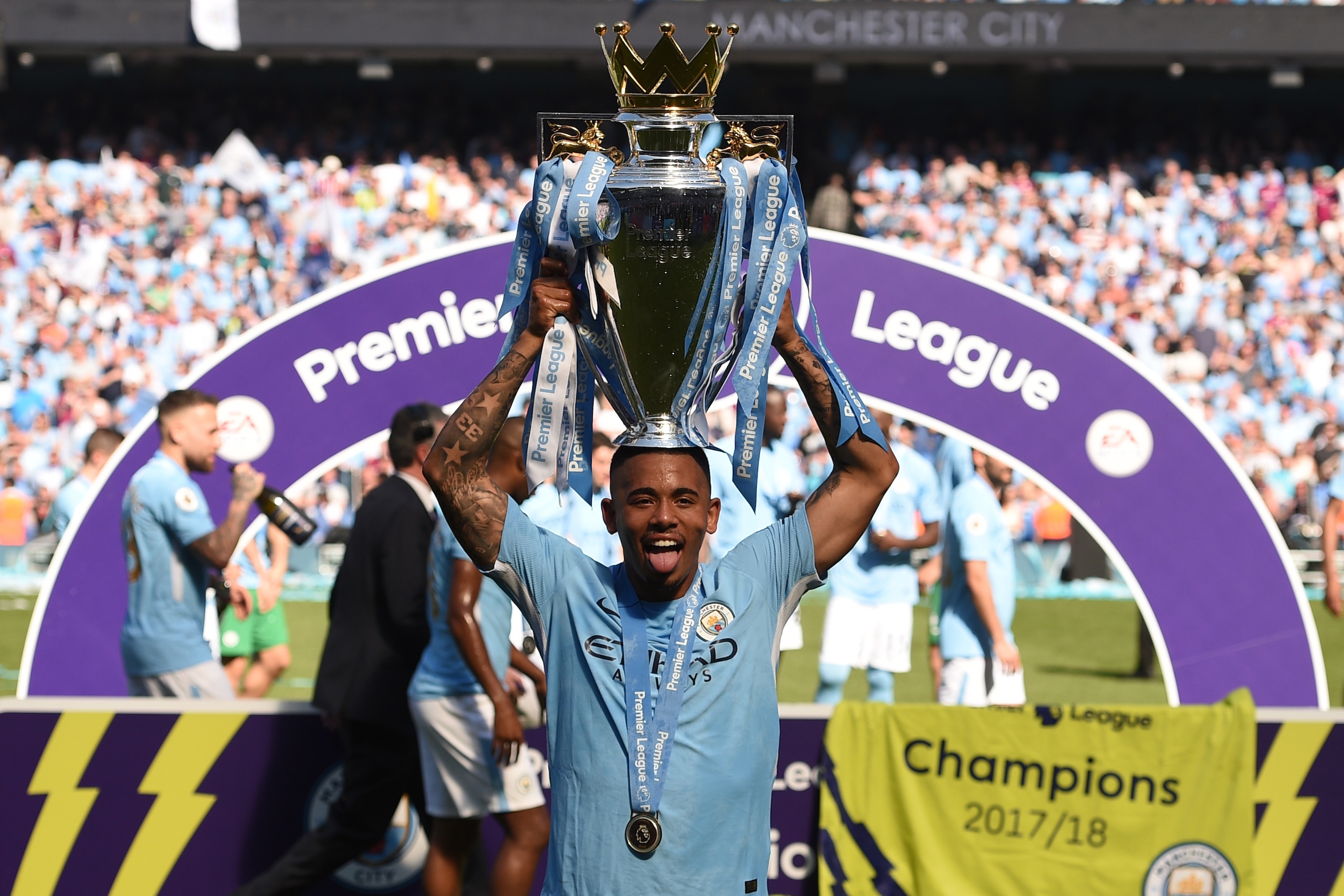 Manchester City's Brazilian striker Gabriel Jesus holds the Premier League trophy on the pitch after the English Premier League football match between Manchester City and Huddersfield Town at the Etihad Stadium in Manchester, north west England, on May 6, Manchester City's Brazilian striker Gabriel Jesus holds the Premier League trophy on the pitch after the English Premier League football match between Manchester City and Huddersfield Town at the Etihad Stadium in Manchester, north west England, on May 6,