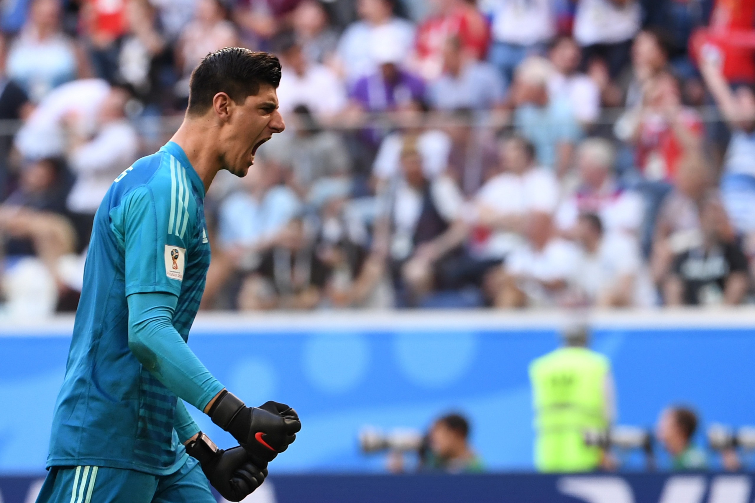 TOPSHOT - Belgium's goalkeeper Thibaut Courtois reacts after Belgium's forward Eden Hazard scored during their Russia 2018 World Cup play-off for third place football match between Belgium and England at the Saint Petersburg Stadium in Saint Petersburg on