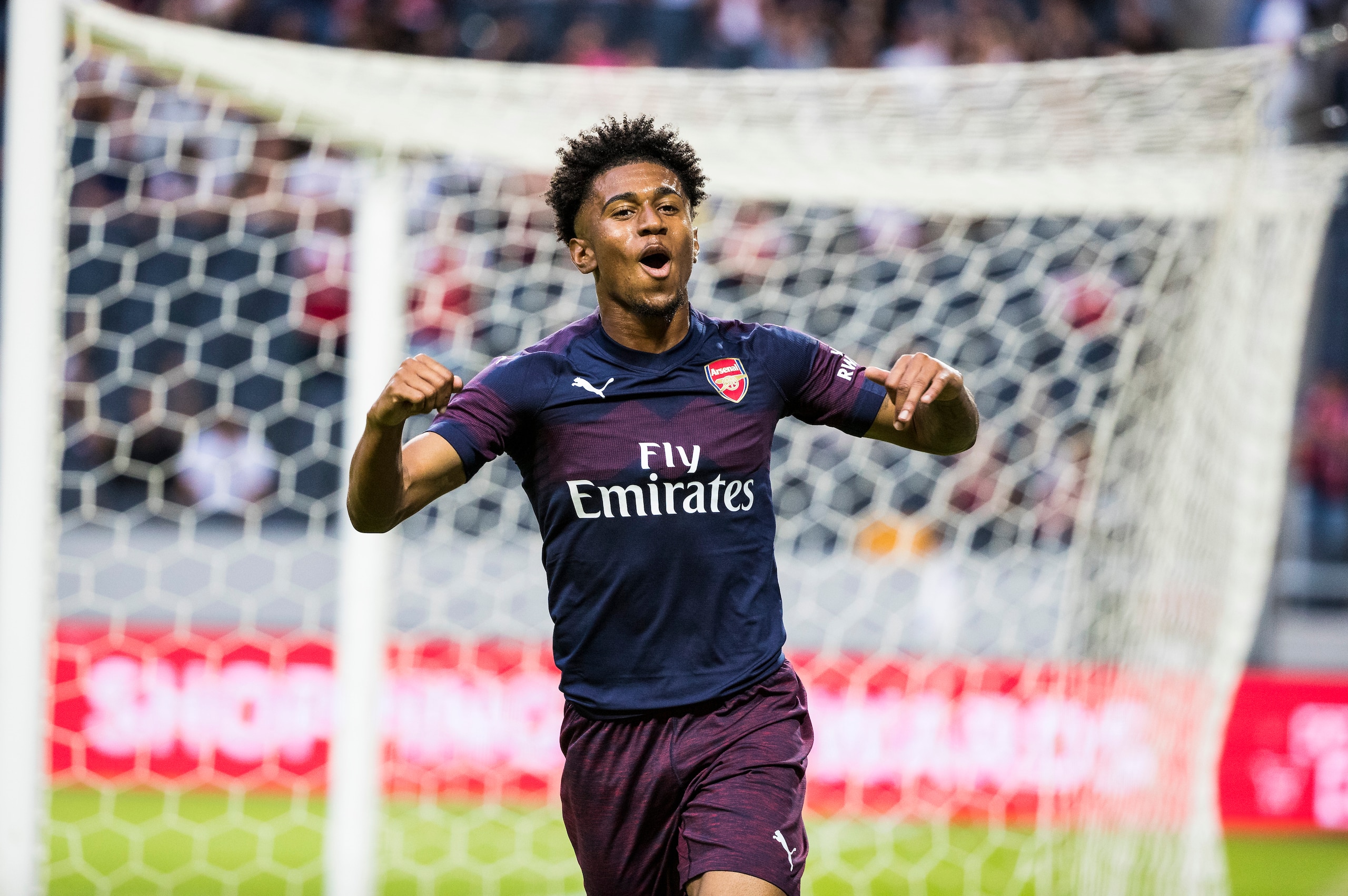STOCKHOLM, SWEDEN - AUGUST 04: Reiss Nelson of Arsenal FC celebrates scoring the 1-0 goal during the Pre-season friendly between Arsenal and SS Lazio at Friends Arena on August 4, 2018 in Stockholm, Sweden. (Photo by MICHAEL CAMPANELLA/Getty Images)