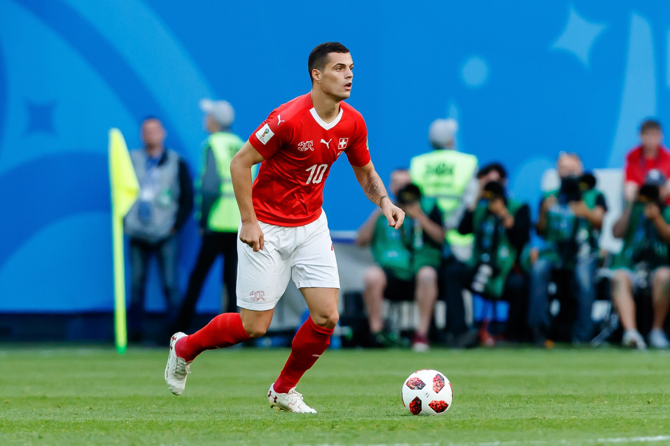SAINT PETERSBURG, RUSSIA - JULY 03: Granit Xhaka of Switzerland controls the ball during the 2018 FIFA World Cup Russia Round of 16 match between Sweden and Switzerland at Saint Petersburg Stadium on July 3, 2018 in Saint Petersburg, Russia. (Photo by TF- SAINT PETERSBURG, RUSSIA - JULY 03: Granit Xhaka of Switzerland controls the ball during the 2018 FIFA World Cup Russia Round of 16 match between Sweden and Switzerland at Saint Petersburg Stadium on July 3, 2018 in Saint Petersburg, Russia. (Photo by TF-
