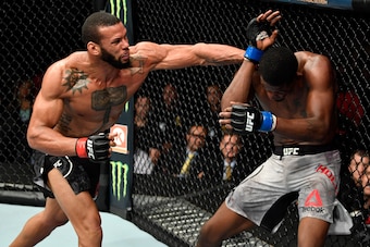 LOS ANGELES, CA - AUGUST 04:  (L-R) Thiago Santos of Brazil punches Kevin Holland in their middleweight fight during the UFC 227 event inside Staples Center on August 4, 2018 in Los Angeles, California. (Photo by Jeff Bottari/Zuffa LLC/Zuffa LLC via Getty