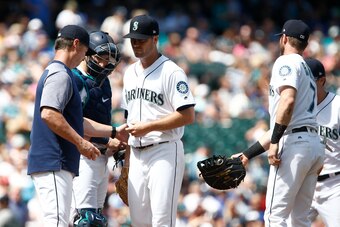 SEATTLE, WA - AUGUST 01:  Wade LeBlanc #49 of the Seattle Mariners is taken out of the game against the Houston Astros by manager Scott Servais in the fifth inning at Safeco Field on August 1, 2018 in Seattle, Washington. (Photo by Lindsey Wasson/Getty Im