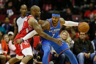 HOUSTON, TX - APRIL 07:  PJ Tucker #4 of the Houston Rockets defends Carmelo Anthony #7 of the Oklahoma City Thunder in the first half at Toyota Center on April 7, 2018 in Houston, Texas.  NOTE TO USER: User expressly acknowledges and agrees that, by down