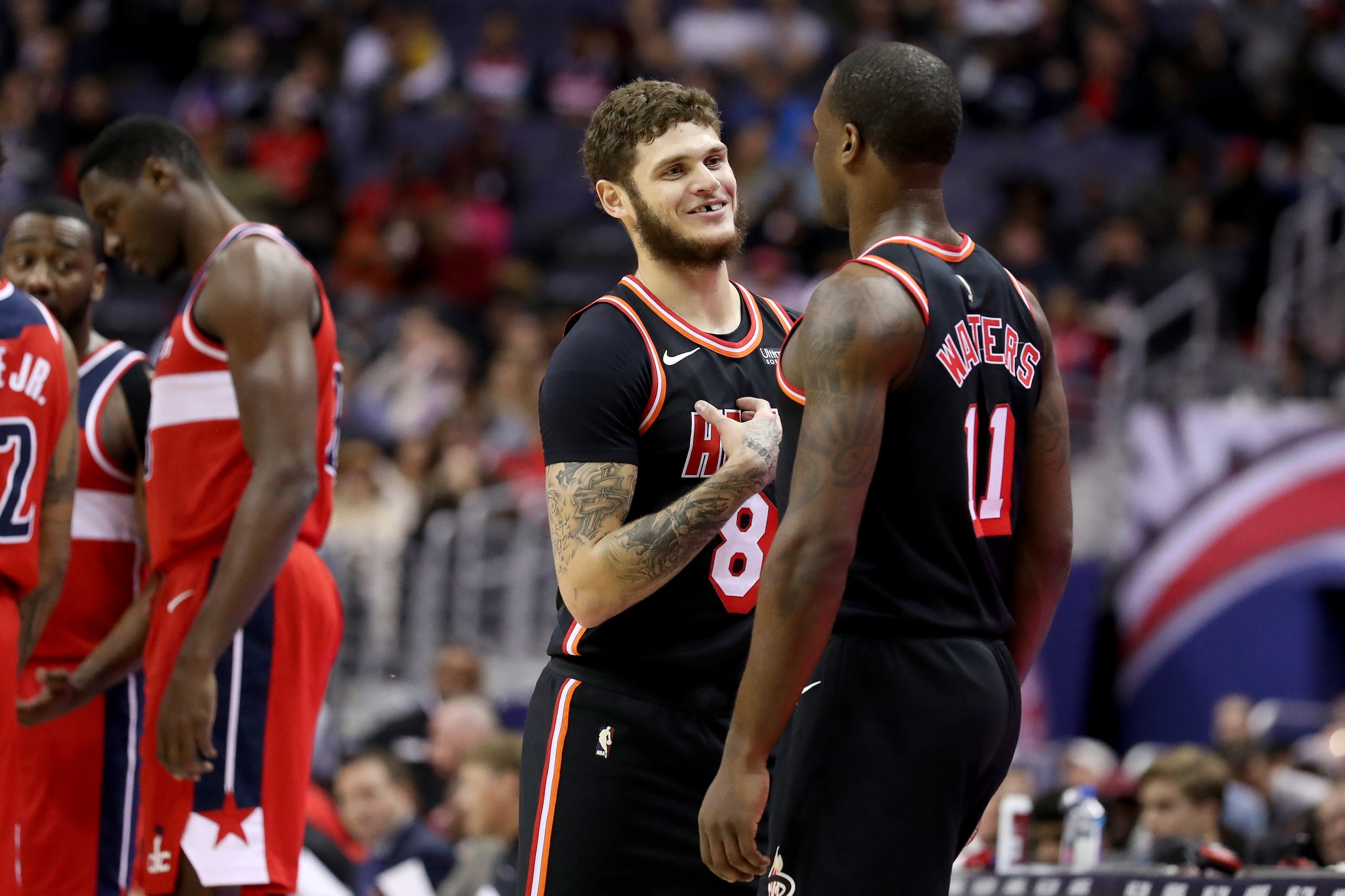 WASHINGTON, DC - NOVEMBER 17: Tyler Johnson #8 and Dion Waiters #11 of the Miami Heat talk on the floor against the Washington Wizards at Capital One Arena on November 17, 2017 in Washington, DC. NOTE TO USER: User expressly acknowledges and agrees that, 