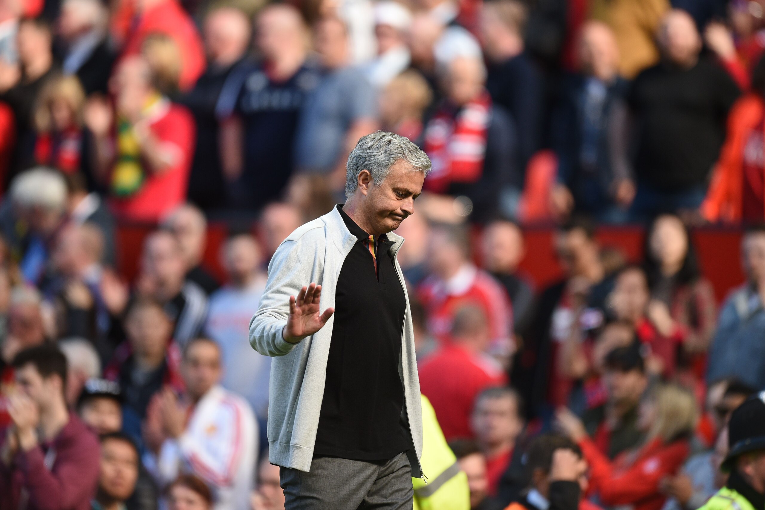 Manchester United's Portuguese manager Jose Mourinho waves as he leaves the pitch after the final whistle in the English Premier League football match between Manchester United and Watford at Old Trafford in Manchester, north west England, on May 13, 2018