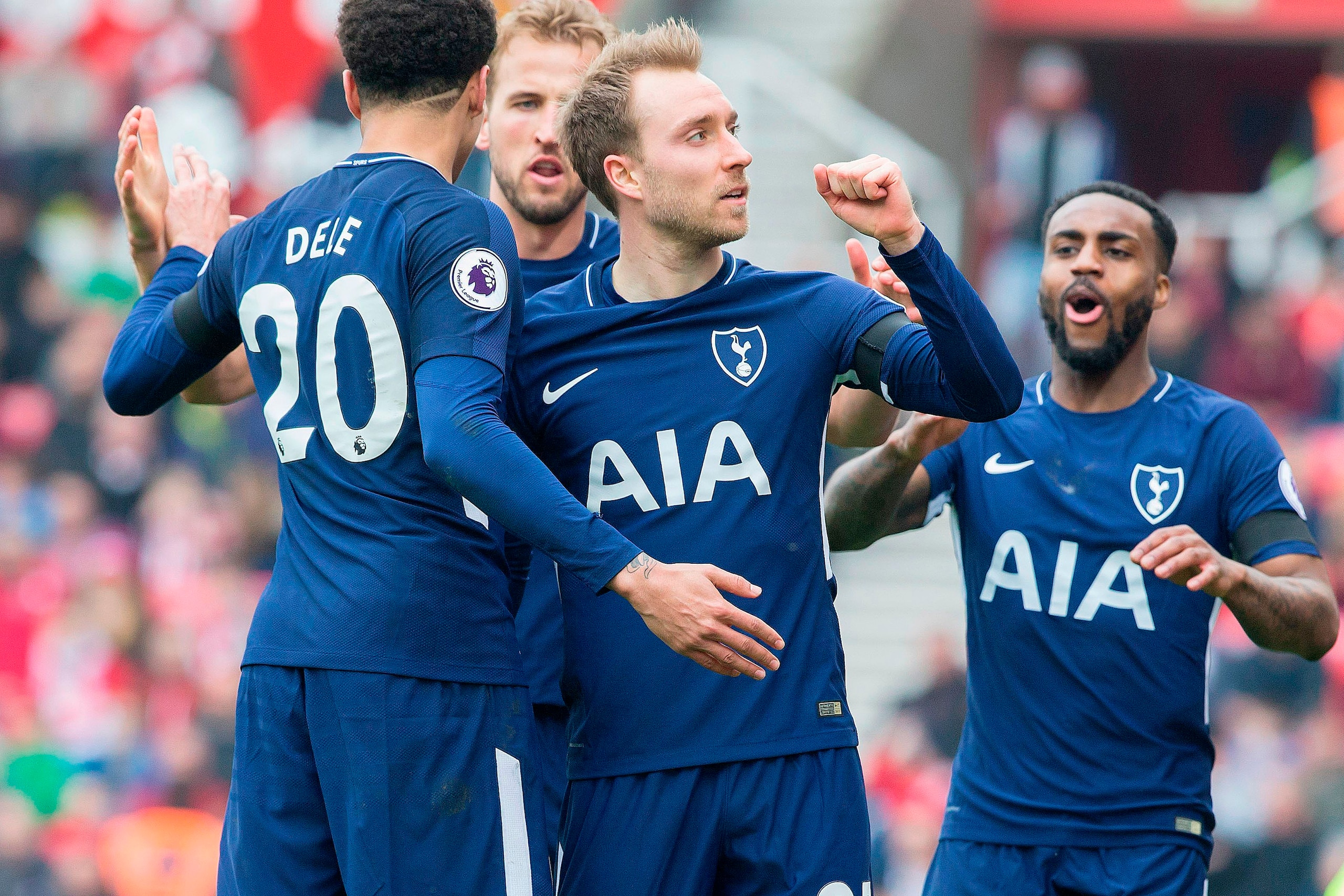 Tottenham Hotspur's Danish midfielder Christian Eriksen (C) celebrates scoring the opening goal during the English Premier League football match between Stoke City and Tottenham Hotspur at the Bet365 Stadium in Stoke-on-Trent, central England on April 7, 