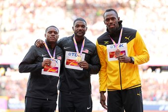 LONDON, ENGLAND - AUGUST 06:  (L-R) Christian Coleman of the United States, silver, Justin Gatlin of the United States, gold, and Usain Bolt of Jamaica, broze pose with their medals for the Men's 100 metres during day three of the 16th IAAF World Athletic